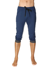 Navy blue ultra-flex tri-color cuffed yoga capri joggers with white side panels and black drawstring waistband