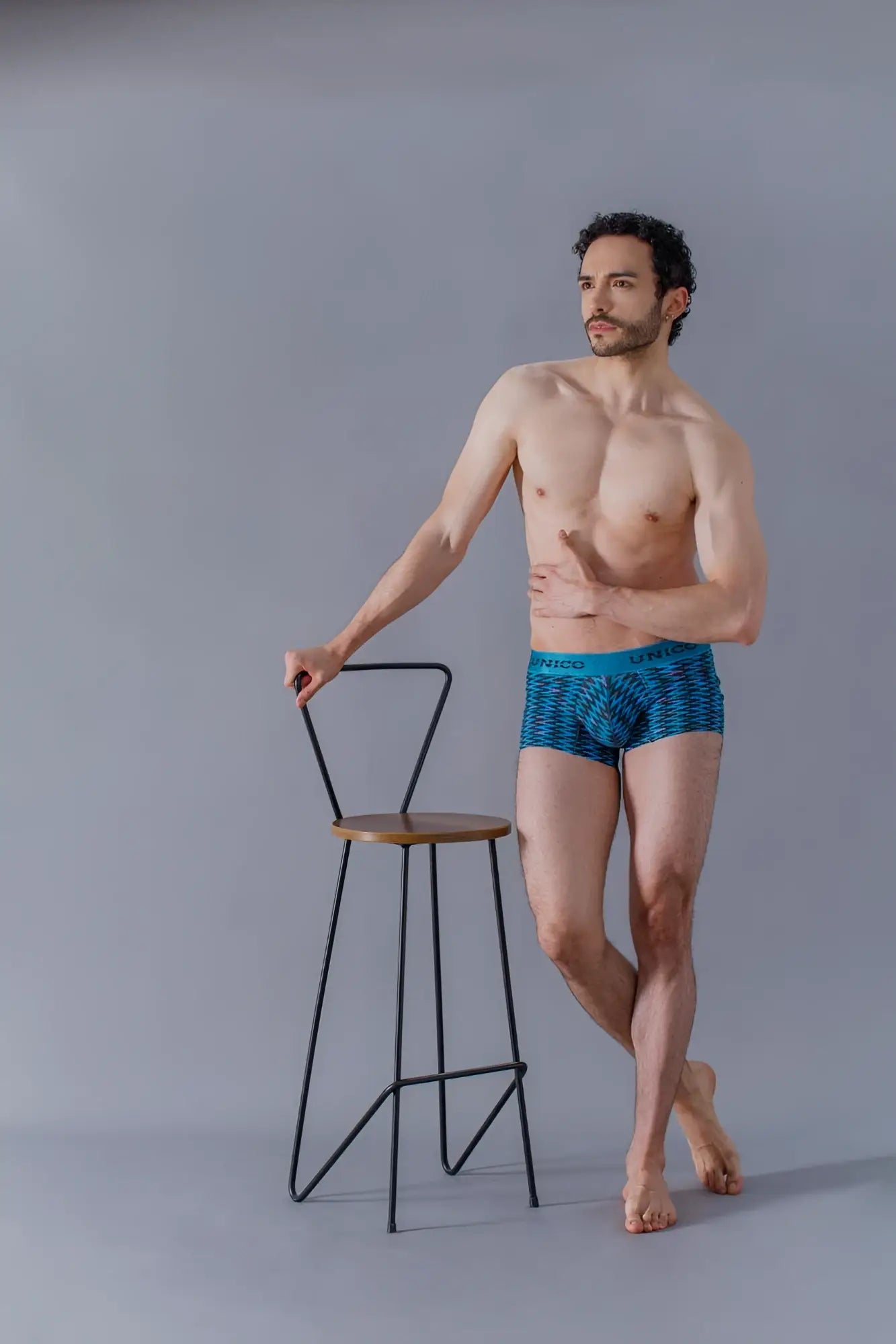 Blue patterned uniqlo filamento trunks with teal waistband designed for comfortable everyday wear