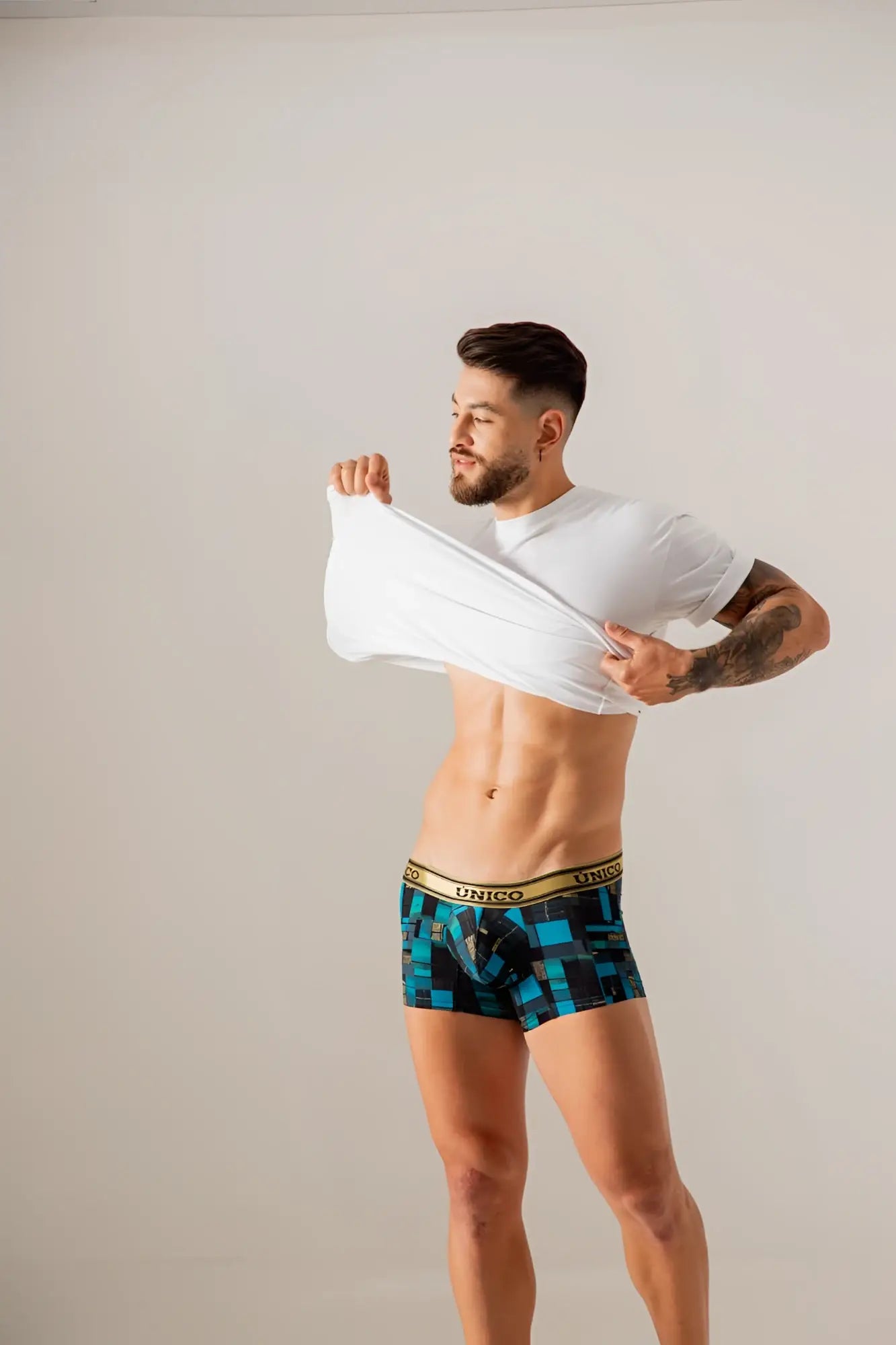 Unico 24010100104 esquema trunks in blue featuring black geometric patterns and a gold waistband boxer briefs