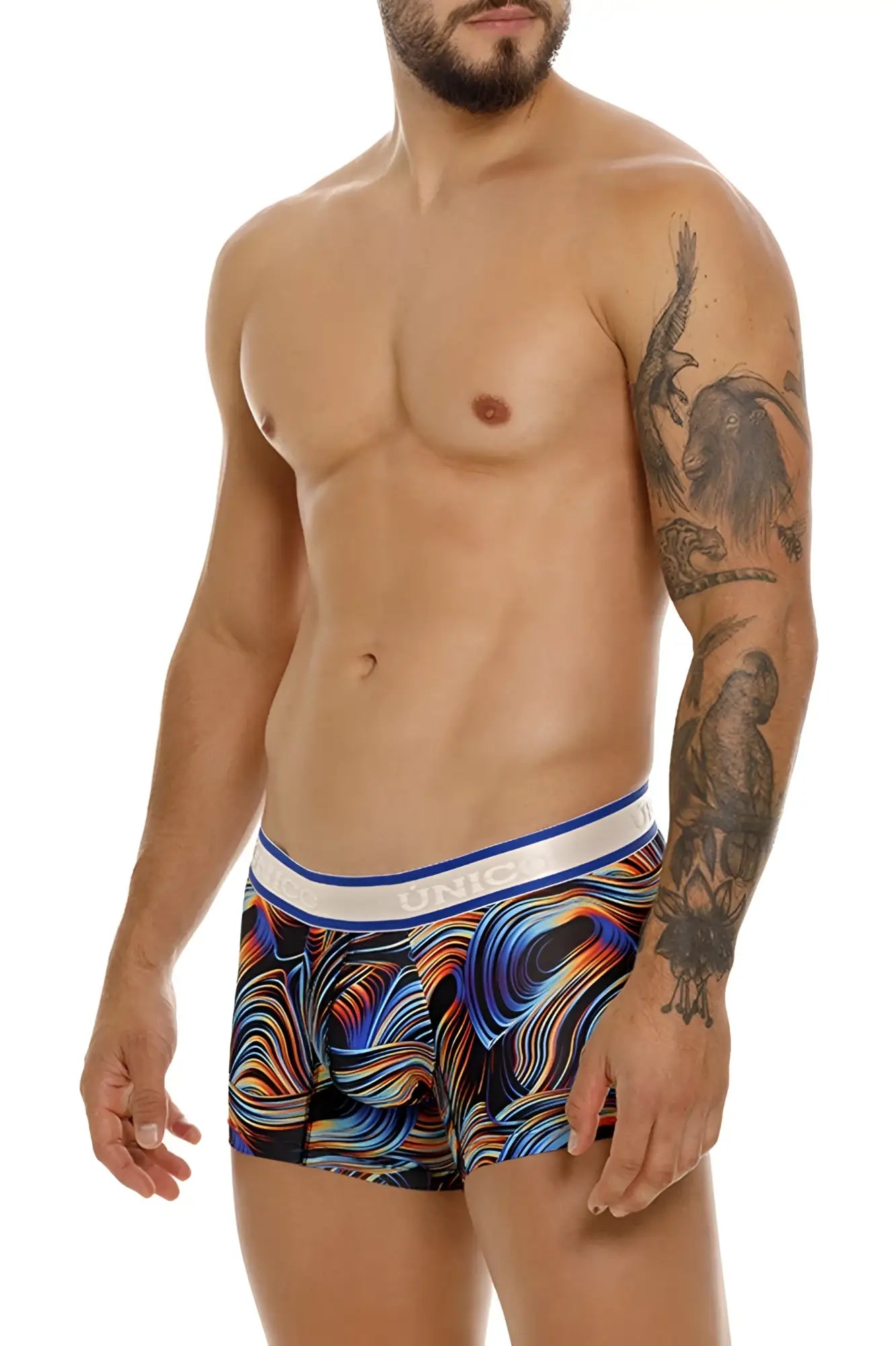 Vibrant abstract wave-patterned unico 24100100104 calamo trunks in bold blues oranges and purples with white unic waistband