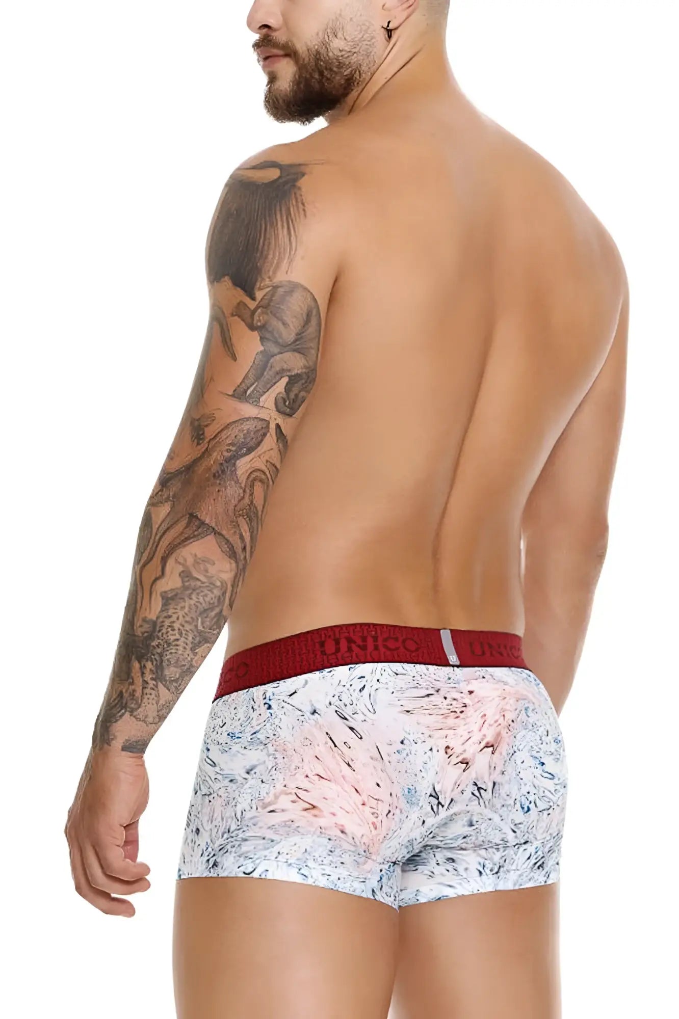 Unico 25020100103 Rizo trunks in white with a pink abstract pattern and red elastic waistband with Unico brand name