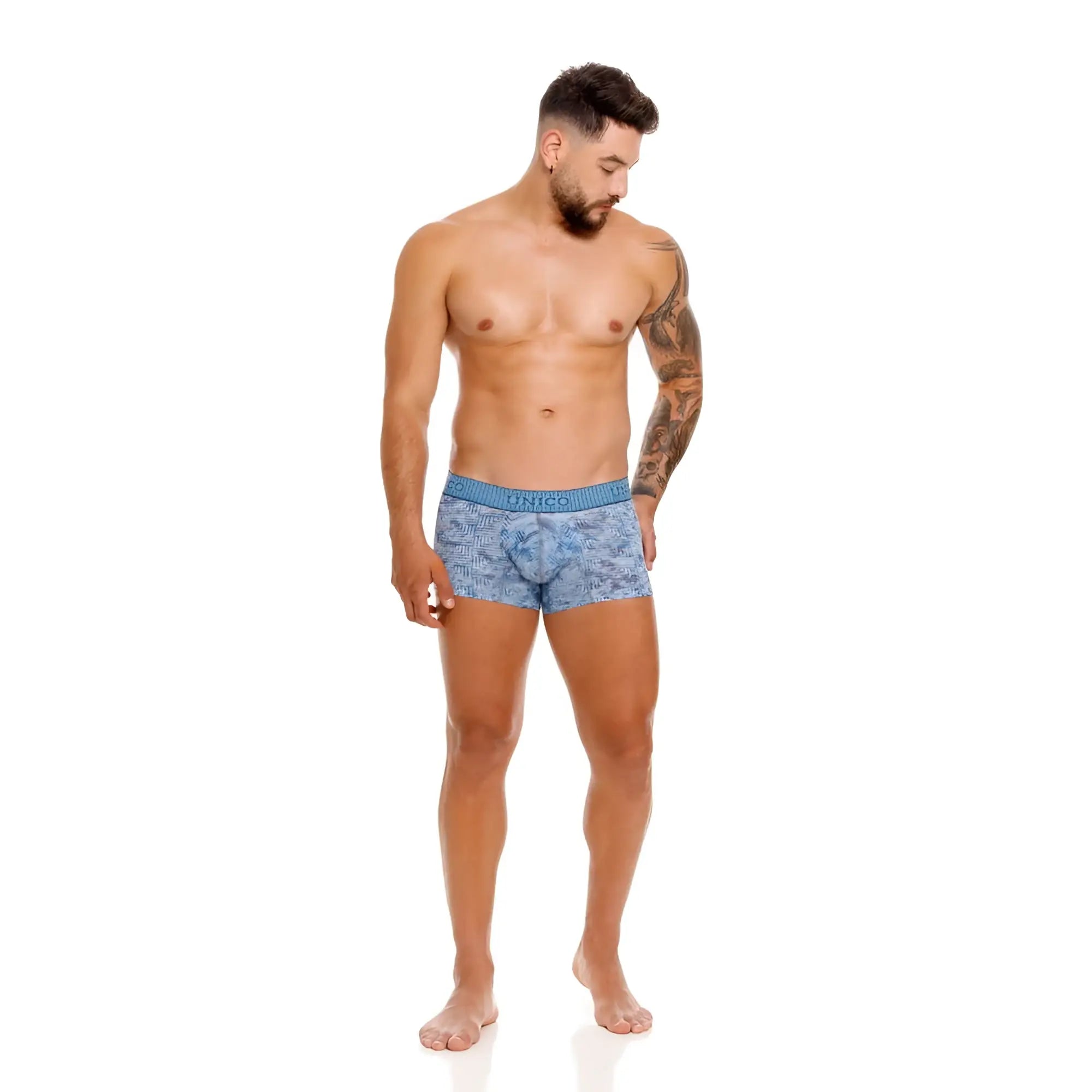Blue patterned men’s boxer briefs with a solid blue waistband featuring the brand name unico ostion trunks color 46-blue