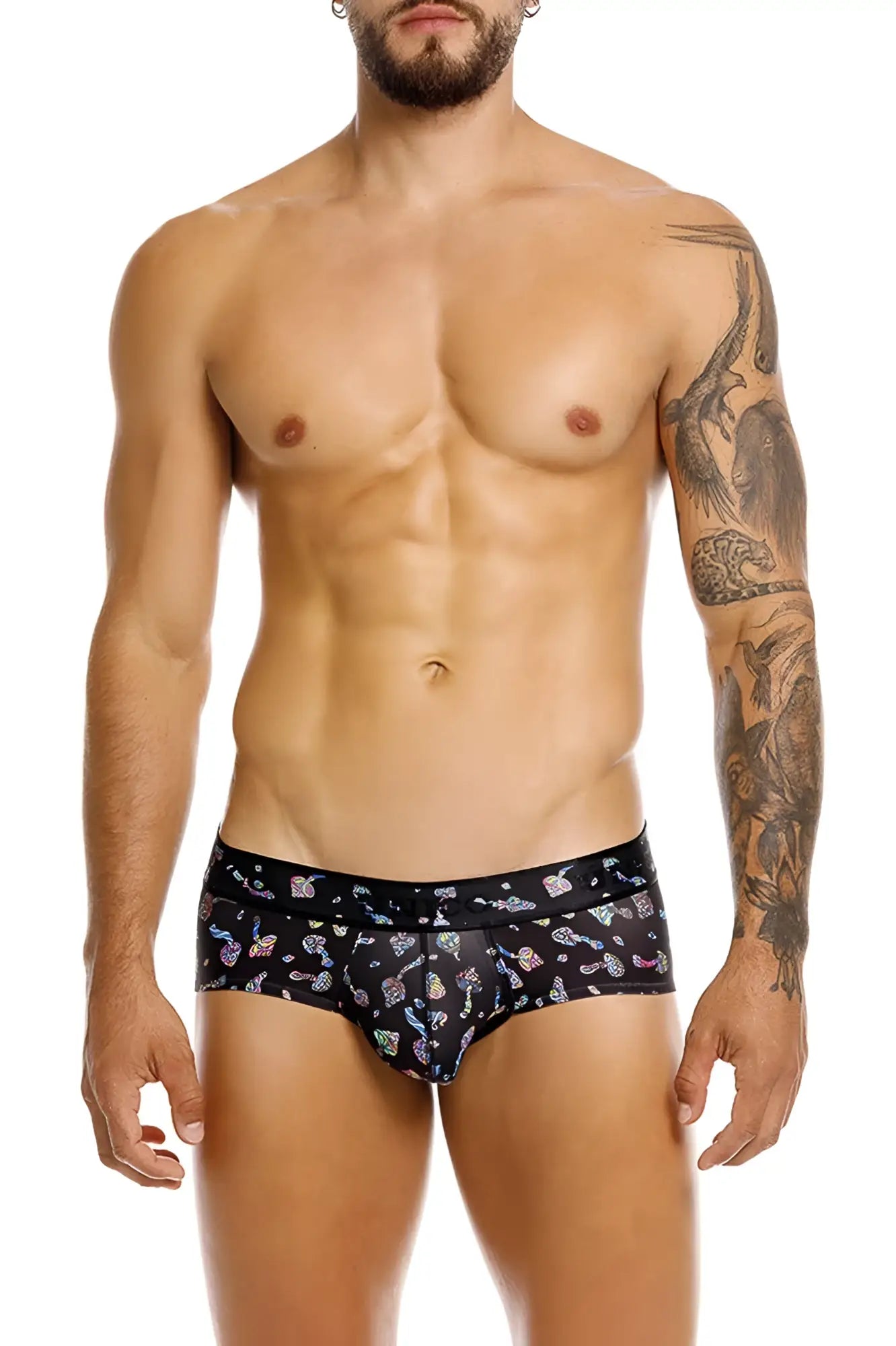Black men’s unico hongos briefs in black feature a vibrant multicolored cartoon mushroom and star pattern