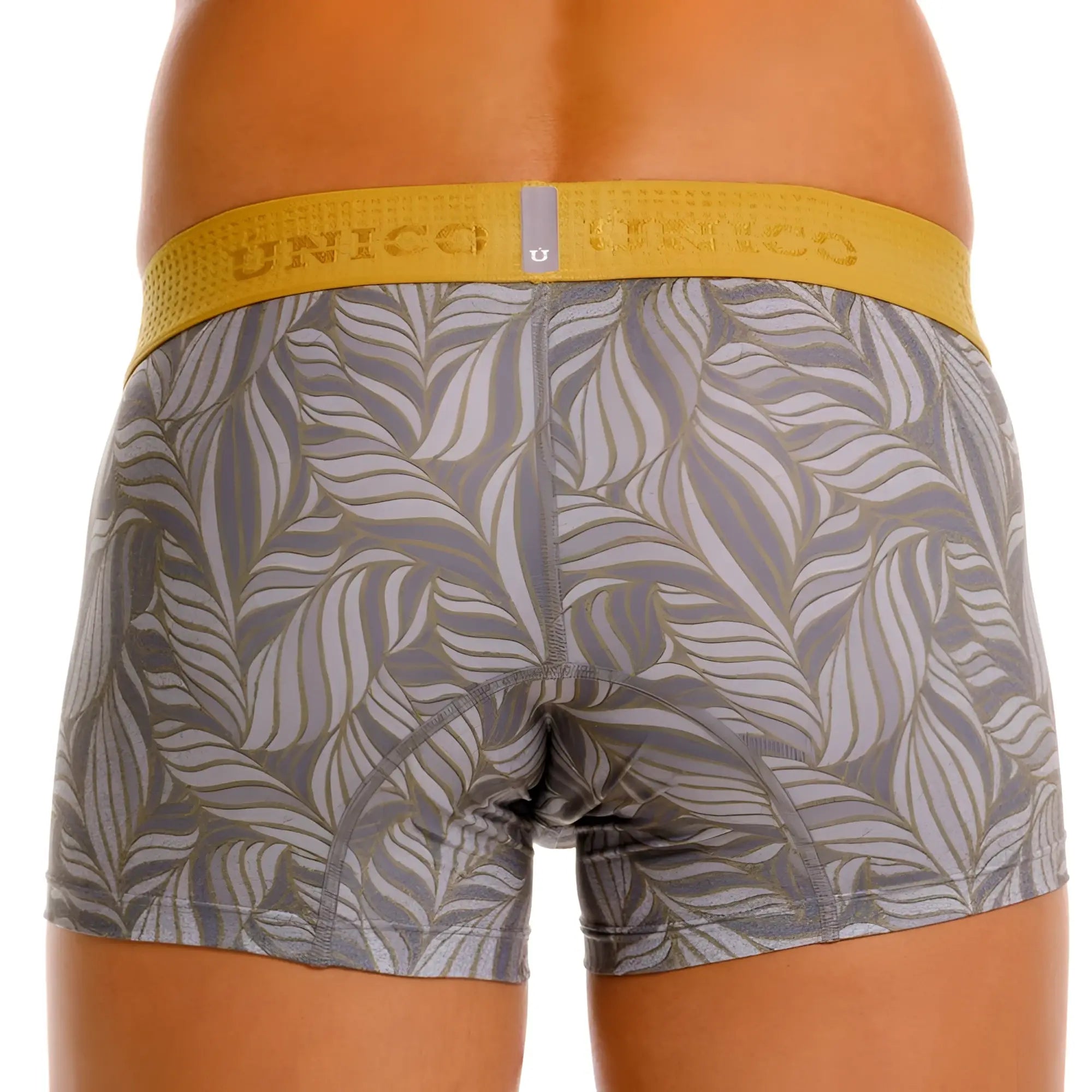 Gray and gold leaf-patterned unico boxer briefs with yellow elastic waistband in color 59-gray shown from the back side