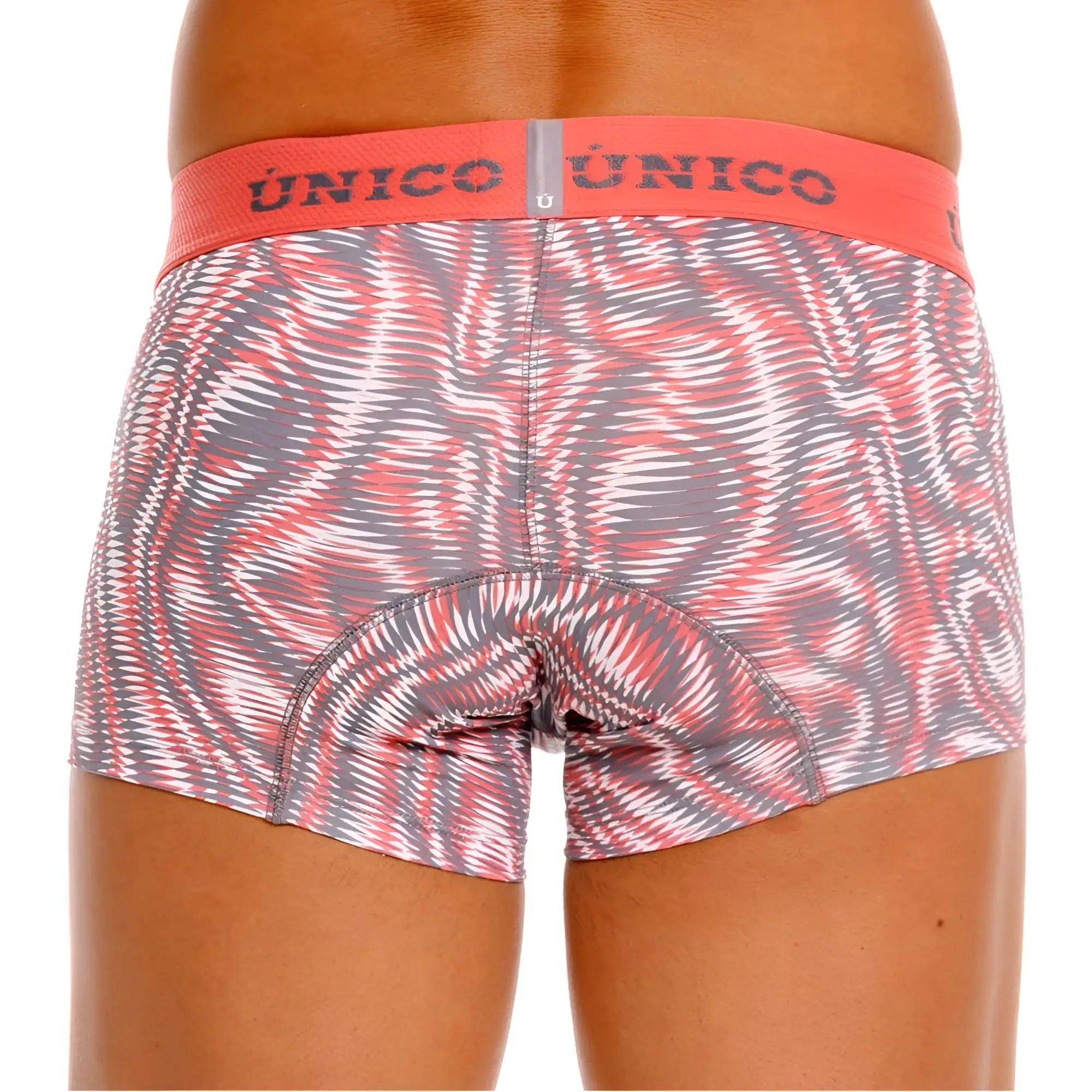A pair of unico 26020100116 acanalado trunks with a pink gray and white swirl pattern and an orange waistband