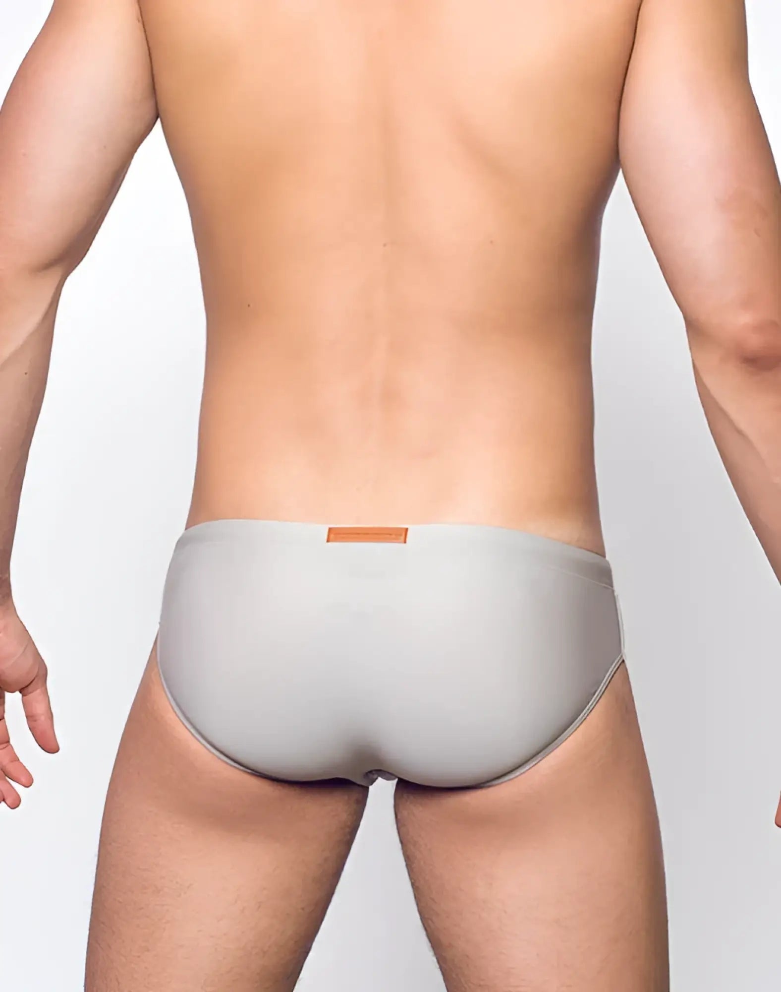 Gray v10 core bikini briefs with soft fabric and small orange label at the waistband