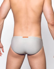 Gray v10 core bikini briefs with soft fabric and small orange label at the waistband
