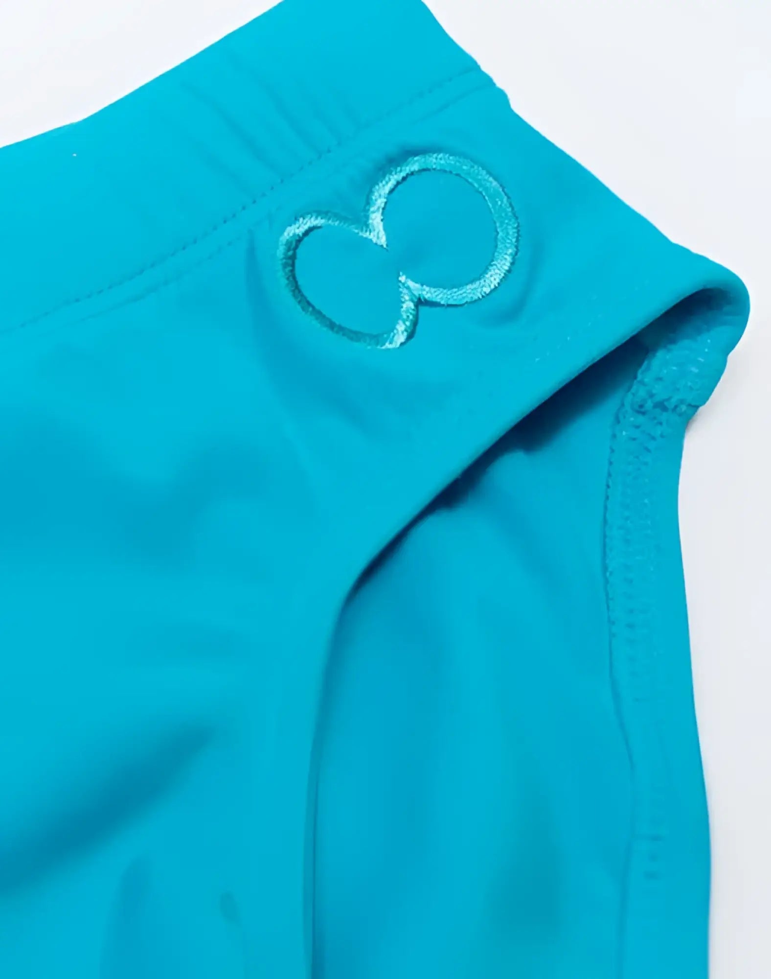Turquoise v10 core bikini athletic shorts with subtle embroidered infinity symbol on the waistband