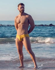 Bright yellow v10 ripple textured swim brief with drawstring waistband designed for swimming and beachwear