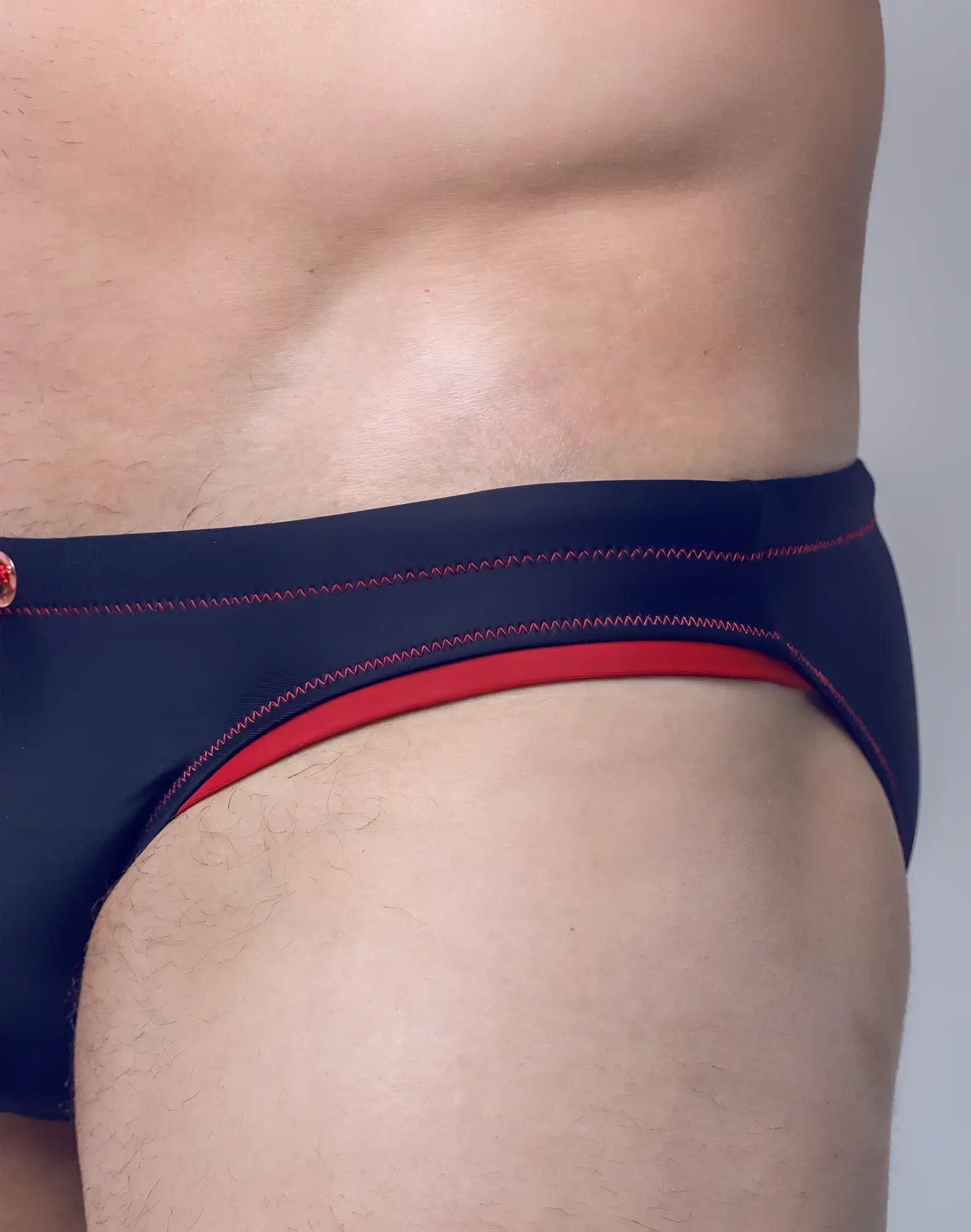 Navy blue v22 rapid swim brief with red trim and contrasting stitching designed for quick drying and active swim use