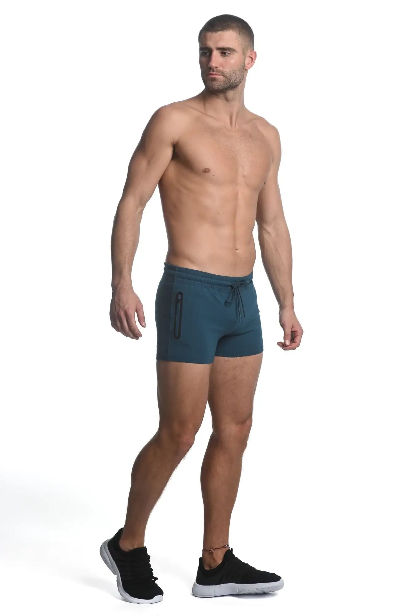 Teal vault gym tech stretch shorts with heat weld zippers featuring drawstring waist and side zipper pockets
