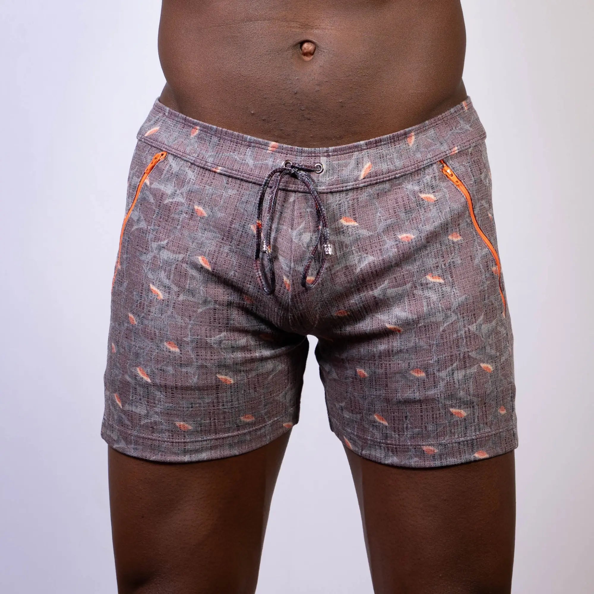Vintage stripes linen texture gray shorts with subtle pattern orange fish motifs and bright orange side zippers
