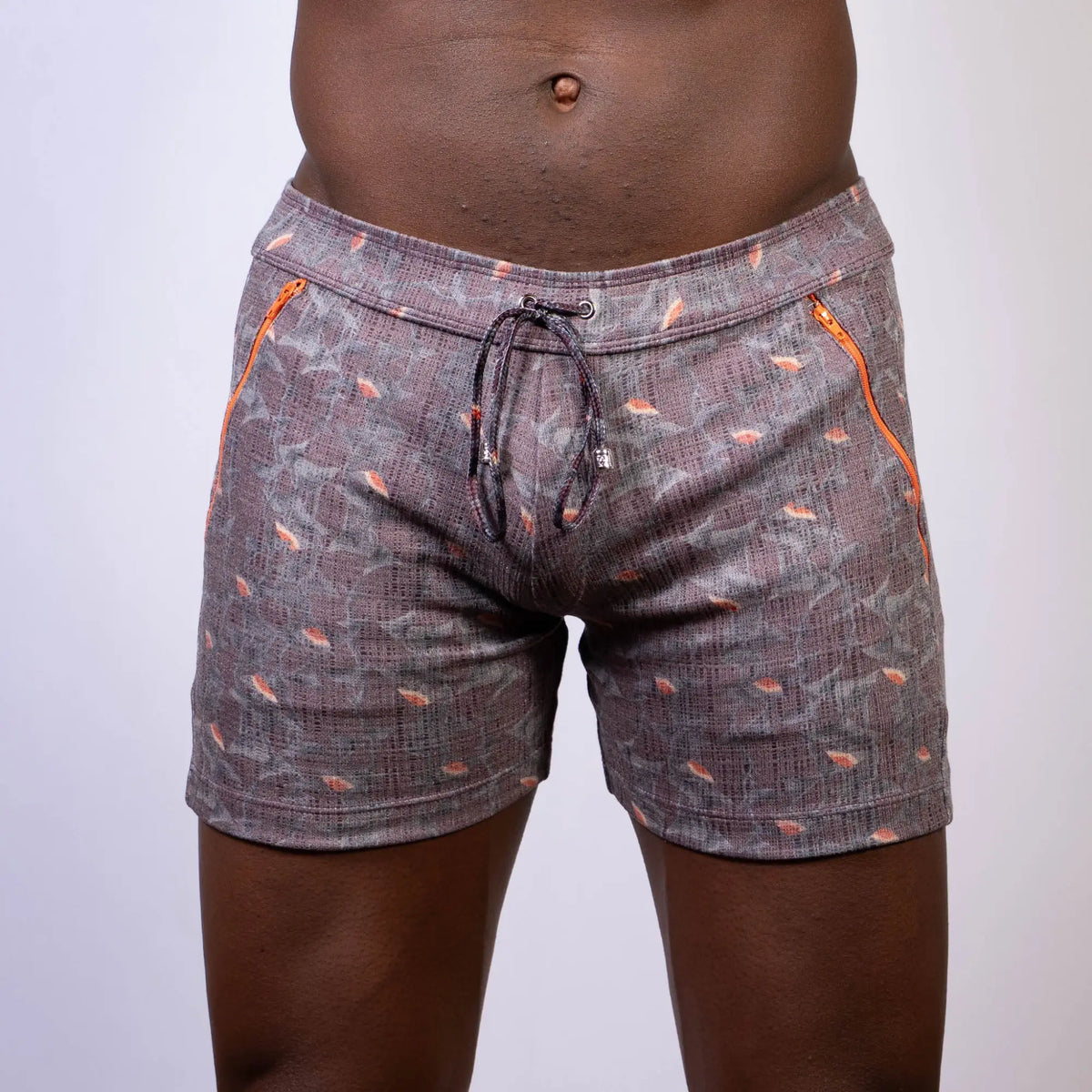 Vintage stripes linen texture gray shorts with subtle pattern orange fish motifs and bright orange side zippers
