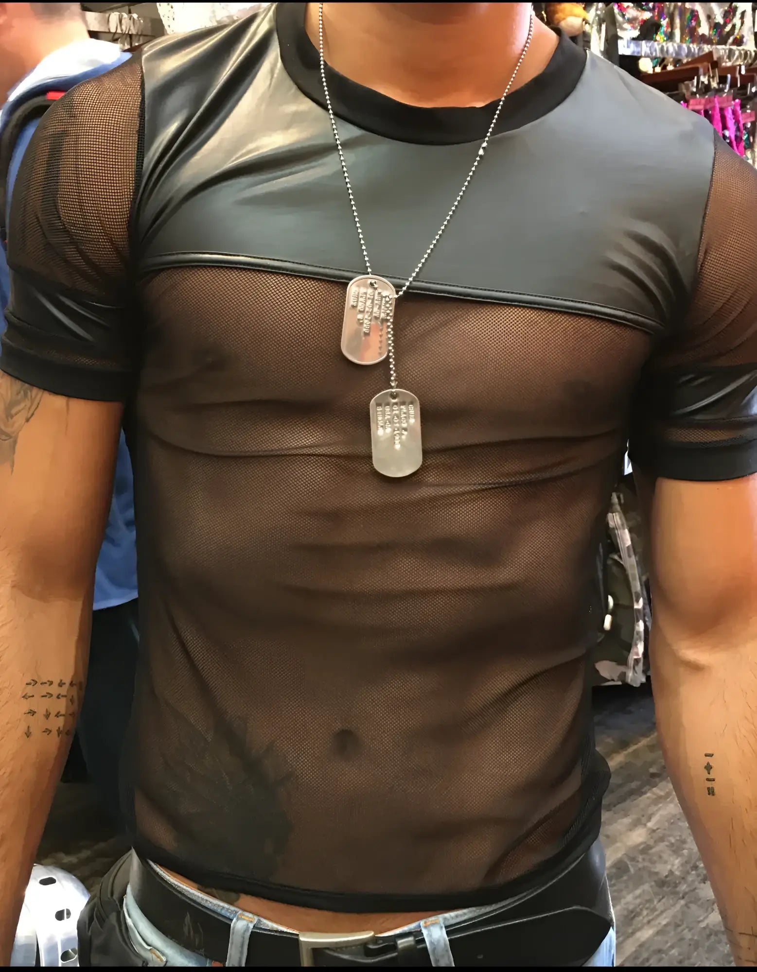 Black vinyl and mesh tee featuring short sleeves and faux leather panels on shoulders and chest