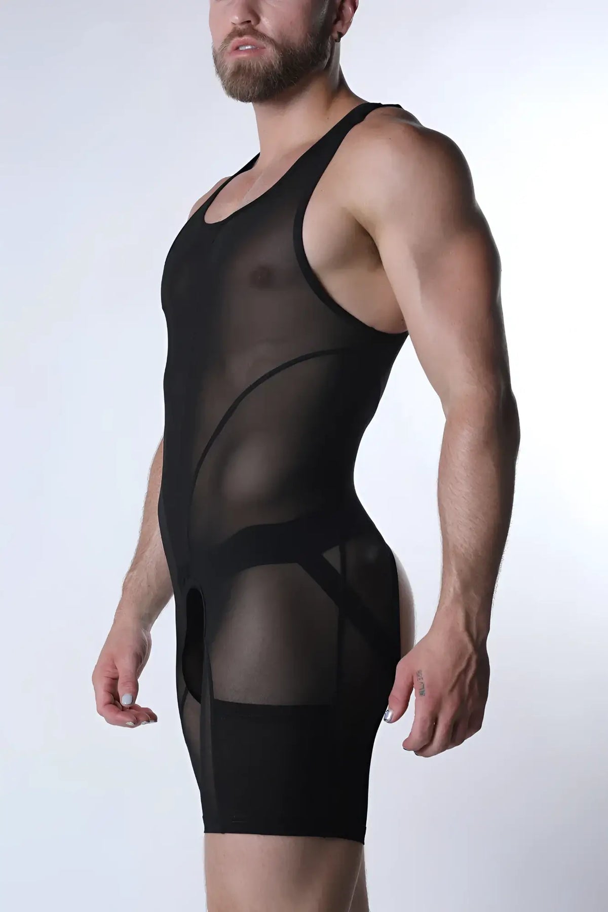 Black sheer mesh bodycon bodysuit with opaque paneling and reinforced straps in the void mesh body suit design