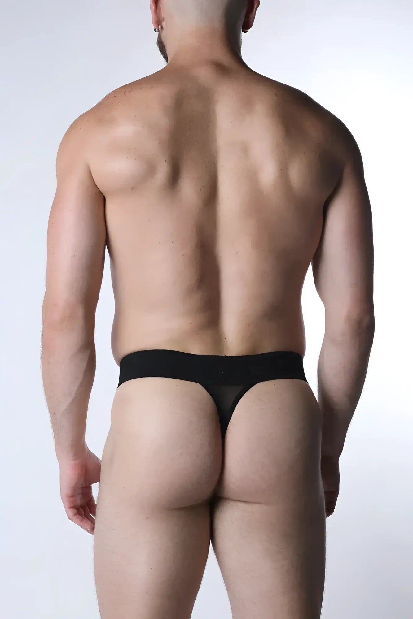 Black sheer mesh thong with solid waistband void mesh thong shown from the back side