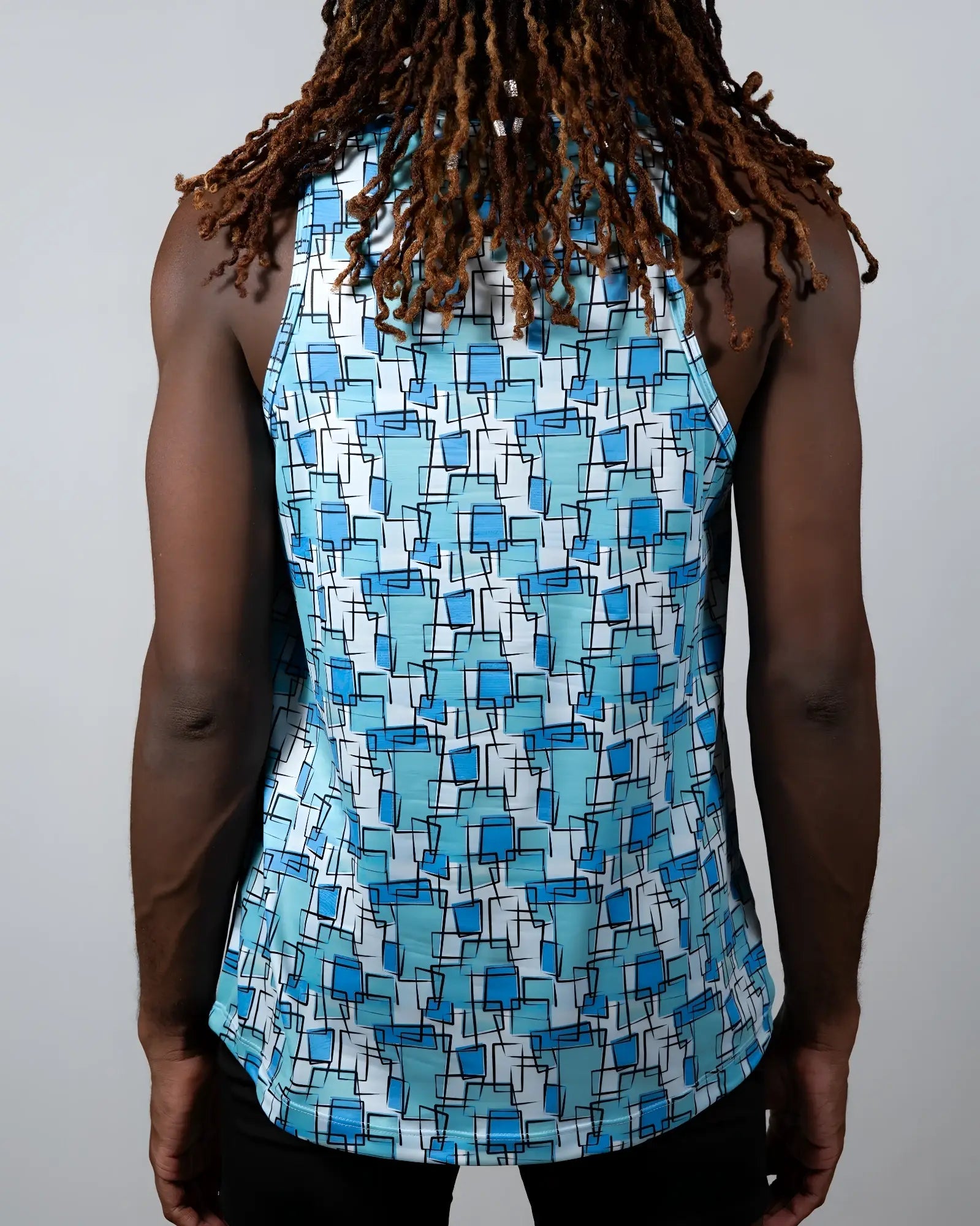 A blue and white geometric patterned sleeveless tank top called wallpaper print tank made of lightweight fabric