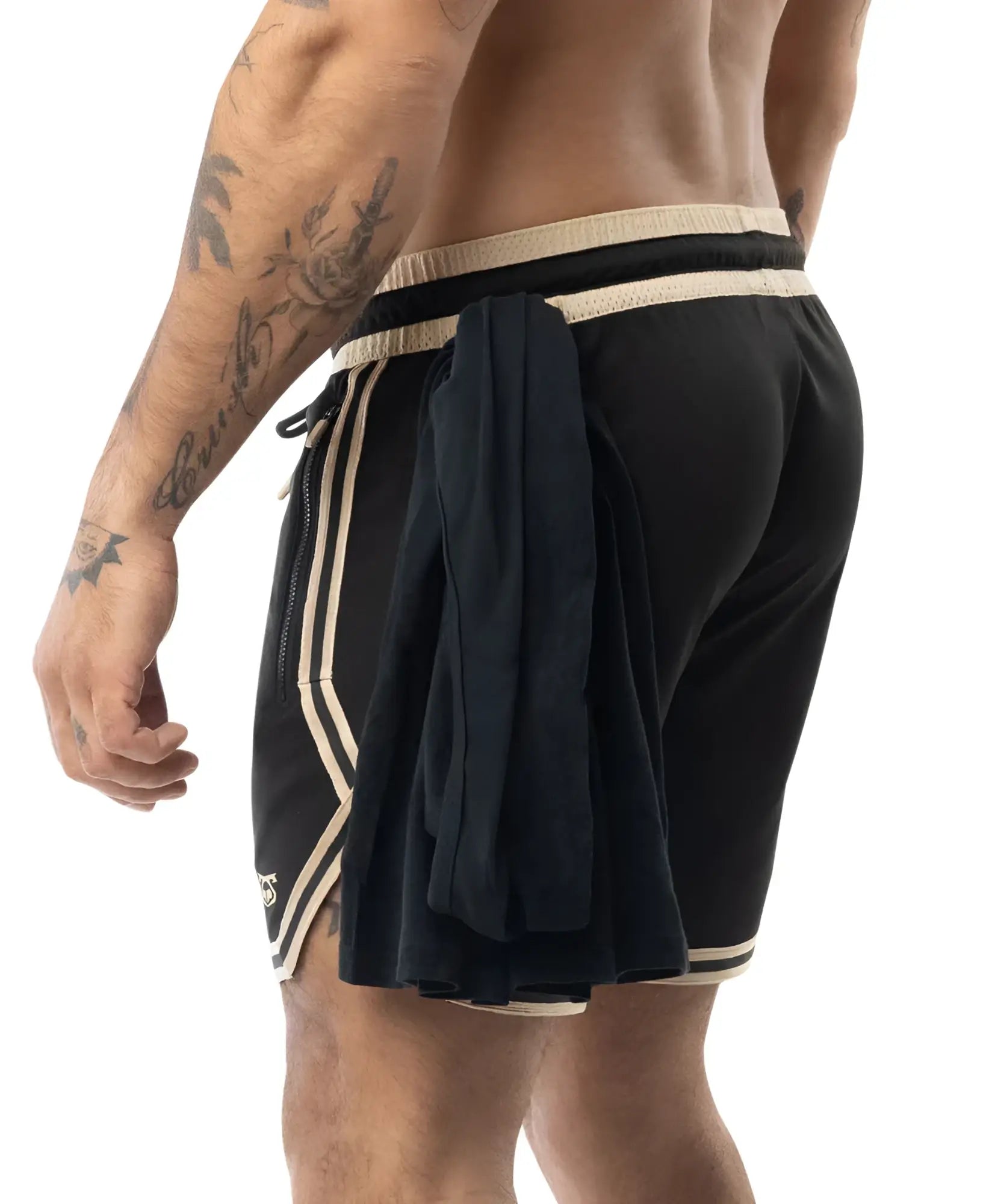 Black warm up rugby shorts with cream stripes and a fabric flap tied at the side on a matching drawstring waistband