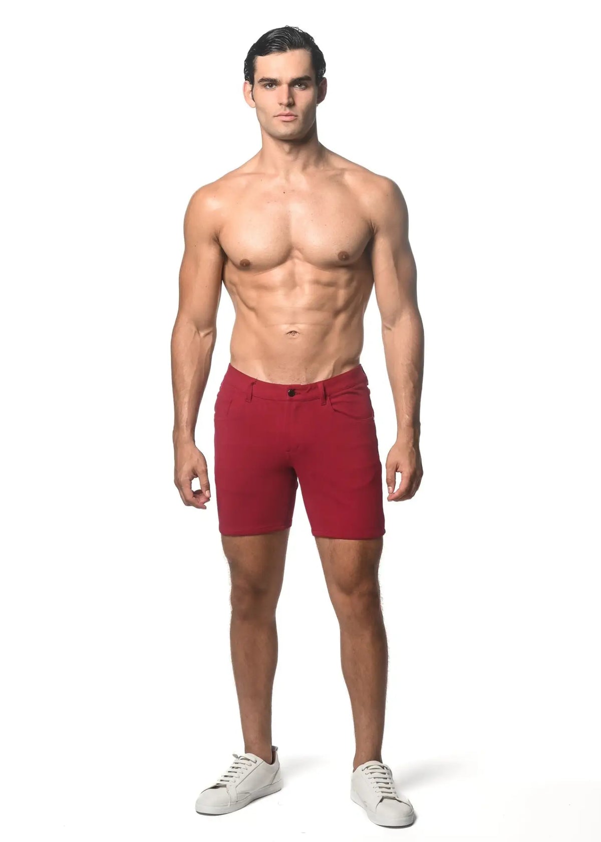 Red washed denim stretch knit men’s shorts with classic fit and button closure for casual wear