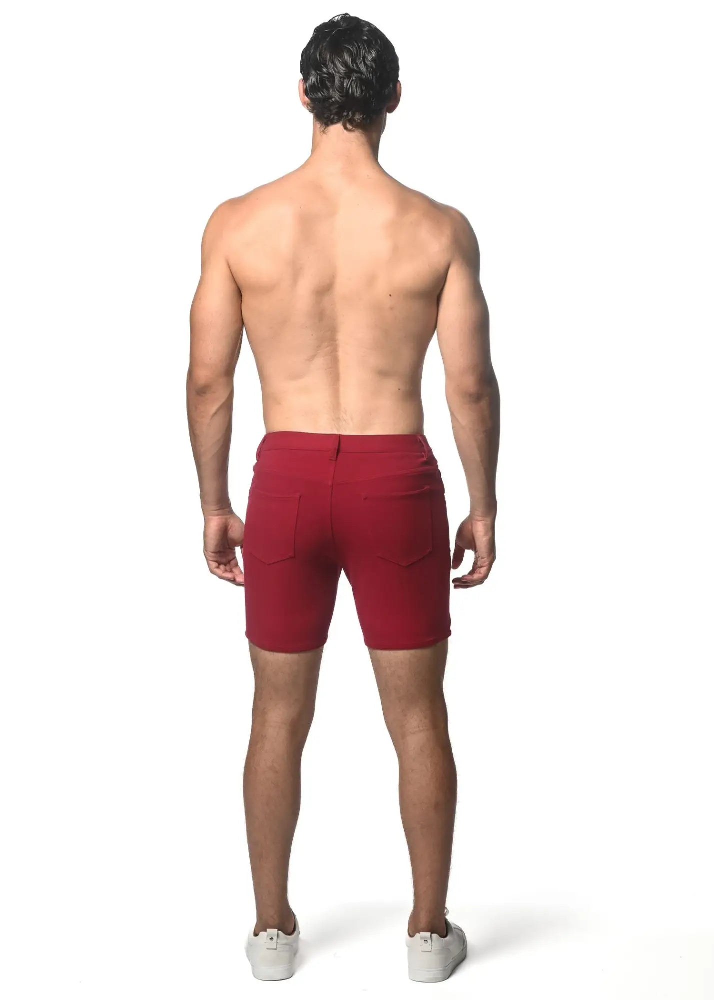 Red washed denim stretch knit shorts with a tailored fit and two rear pockets visible from the back side
