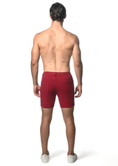 Red washed denim stretch knit shorts with a tailored fit and two rear pockets visible from the back side