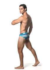 Watercolor stripe printed swim brief in blue and white striped fabric designed for comfortable swimming use