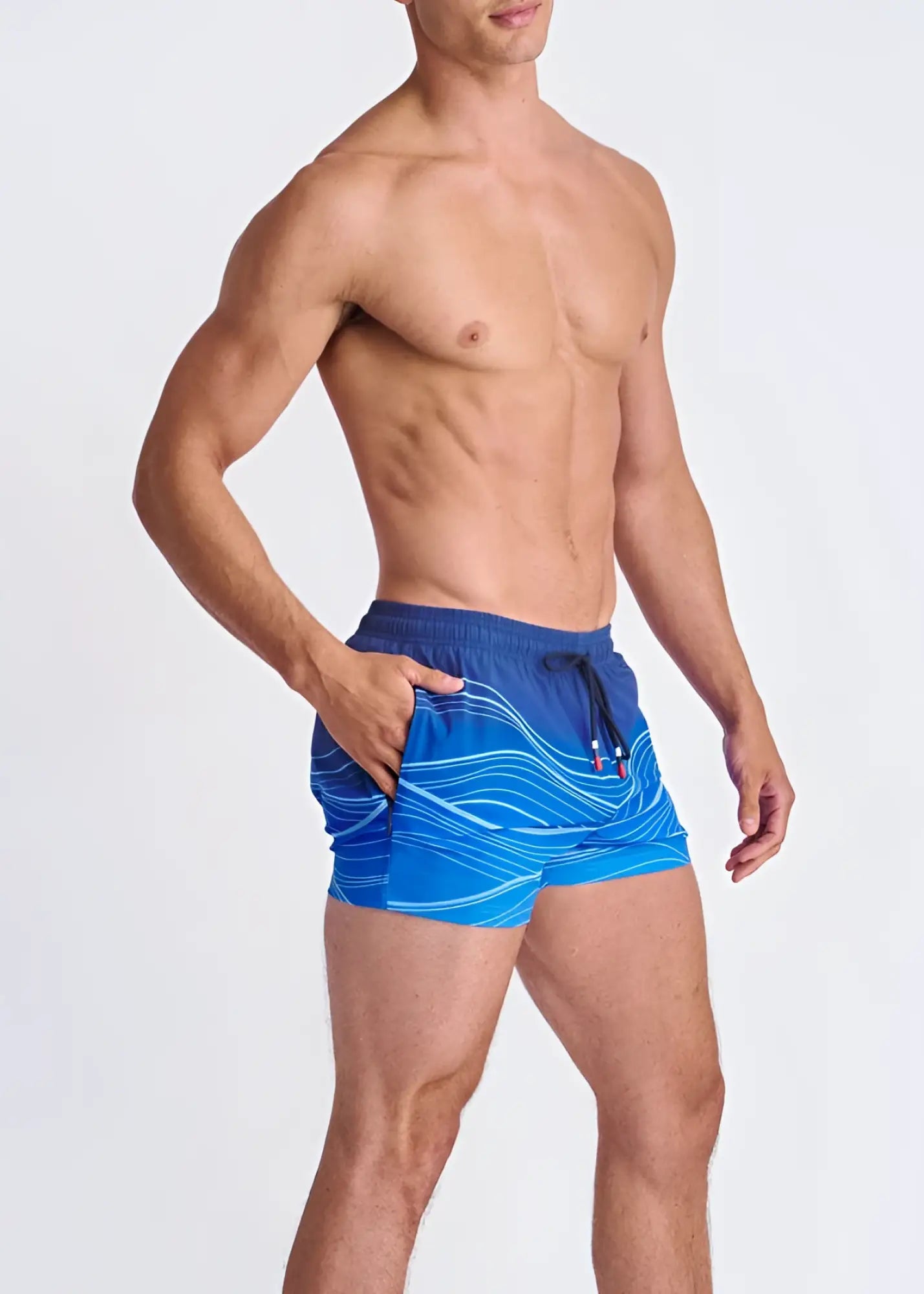 Blue waves print swim shorts with white wavy patterns black drawstring waistband and mesh lining for quick drying
