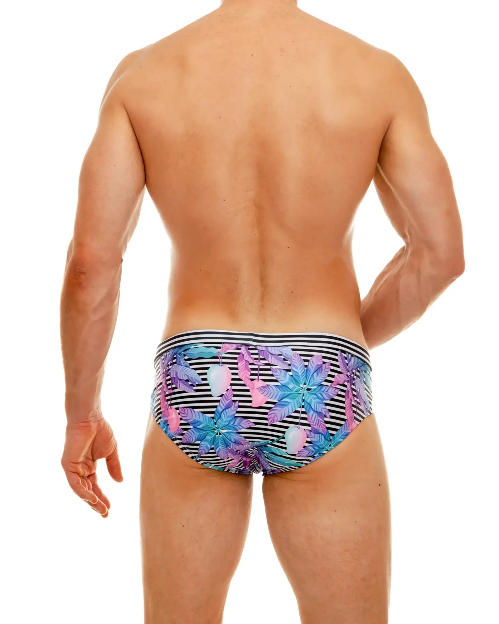 Wild mango swim brief featuring vibrant tropical print swim trunks with bold black and white striped waistband