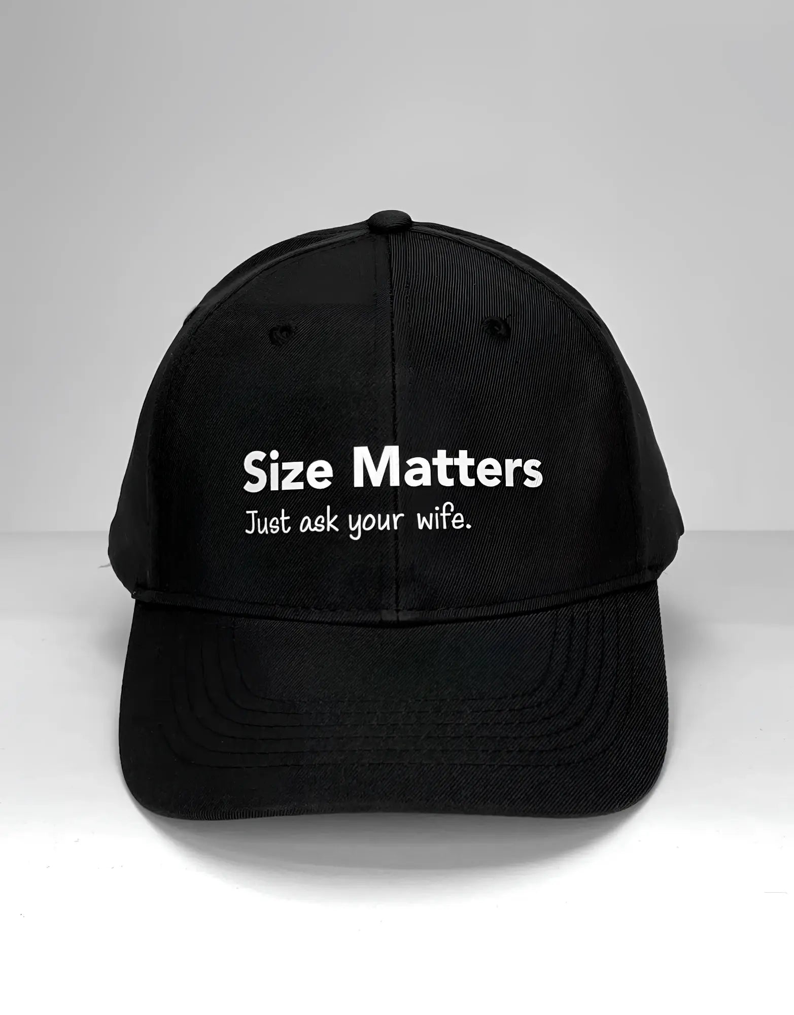 Black WildmanT baseball cap with white embroidered size matters just ask your wife text on front panel