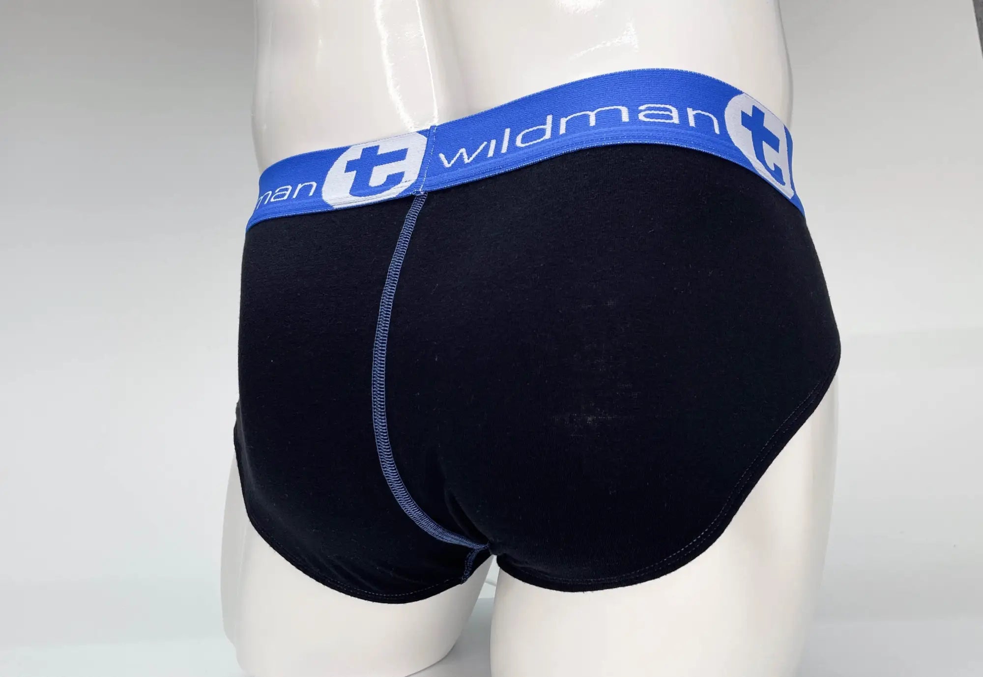 Black cotton wildman big boy pouch briefs with blue waistband featuring wildman logo and white lettering