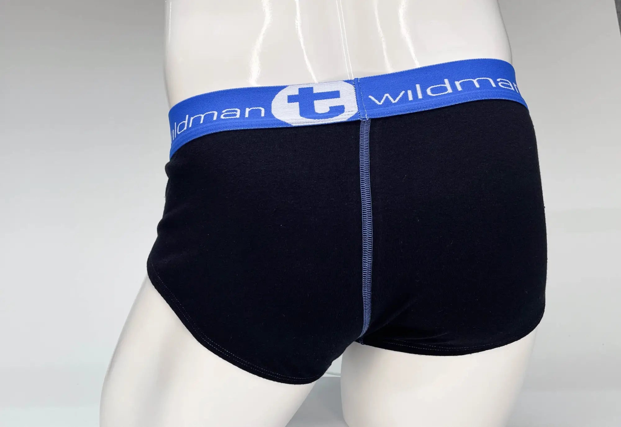 Black cotton briefs with blue waistband featuring wildman brand logo and white lettering wildmant big boy pouch