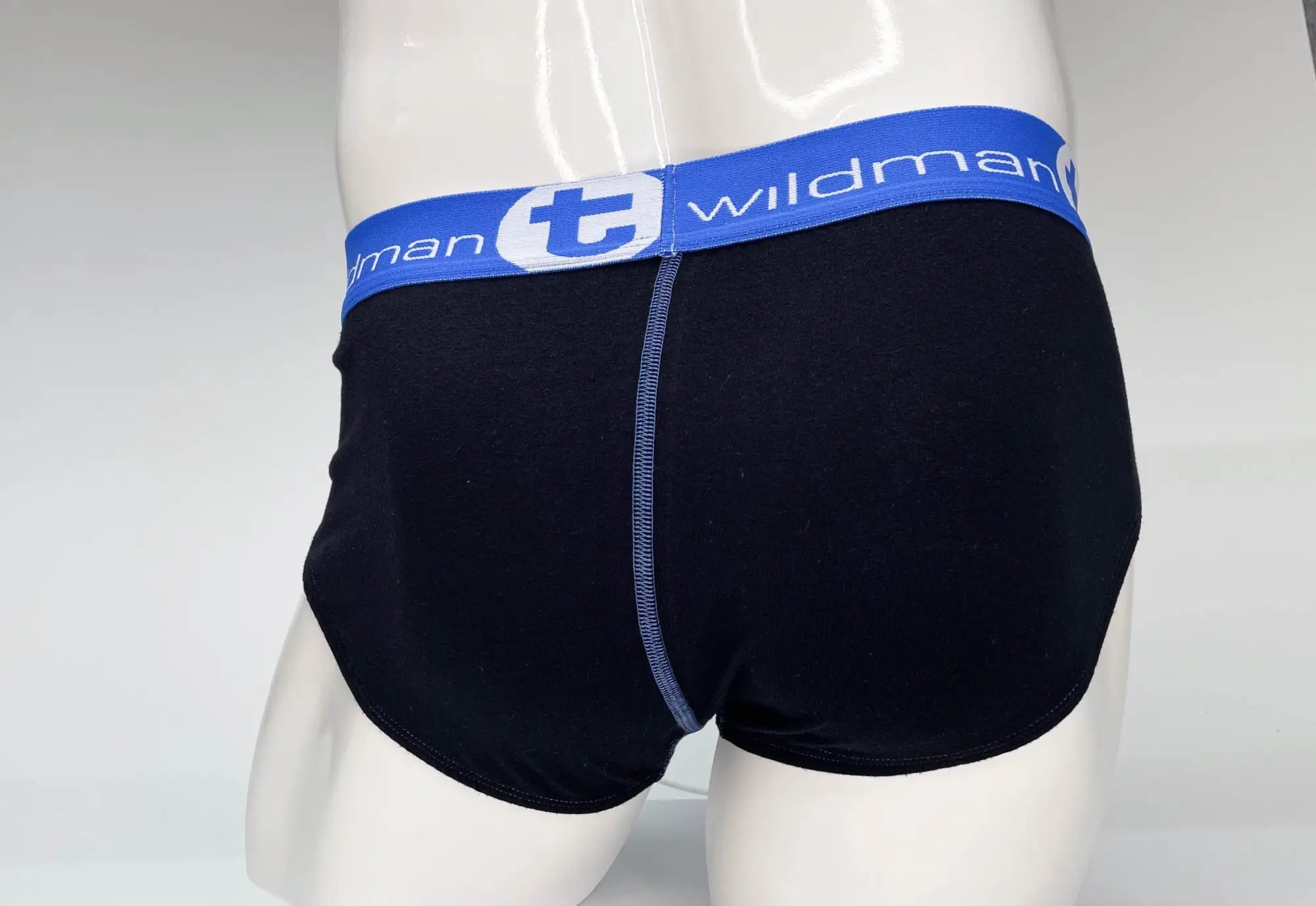 Black wildman men’s cotton briefs with a blue elastic waistband featuring the brand logo pouch design