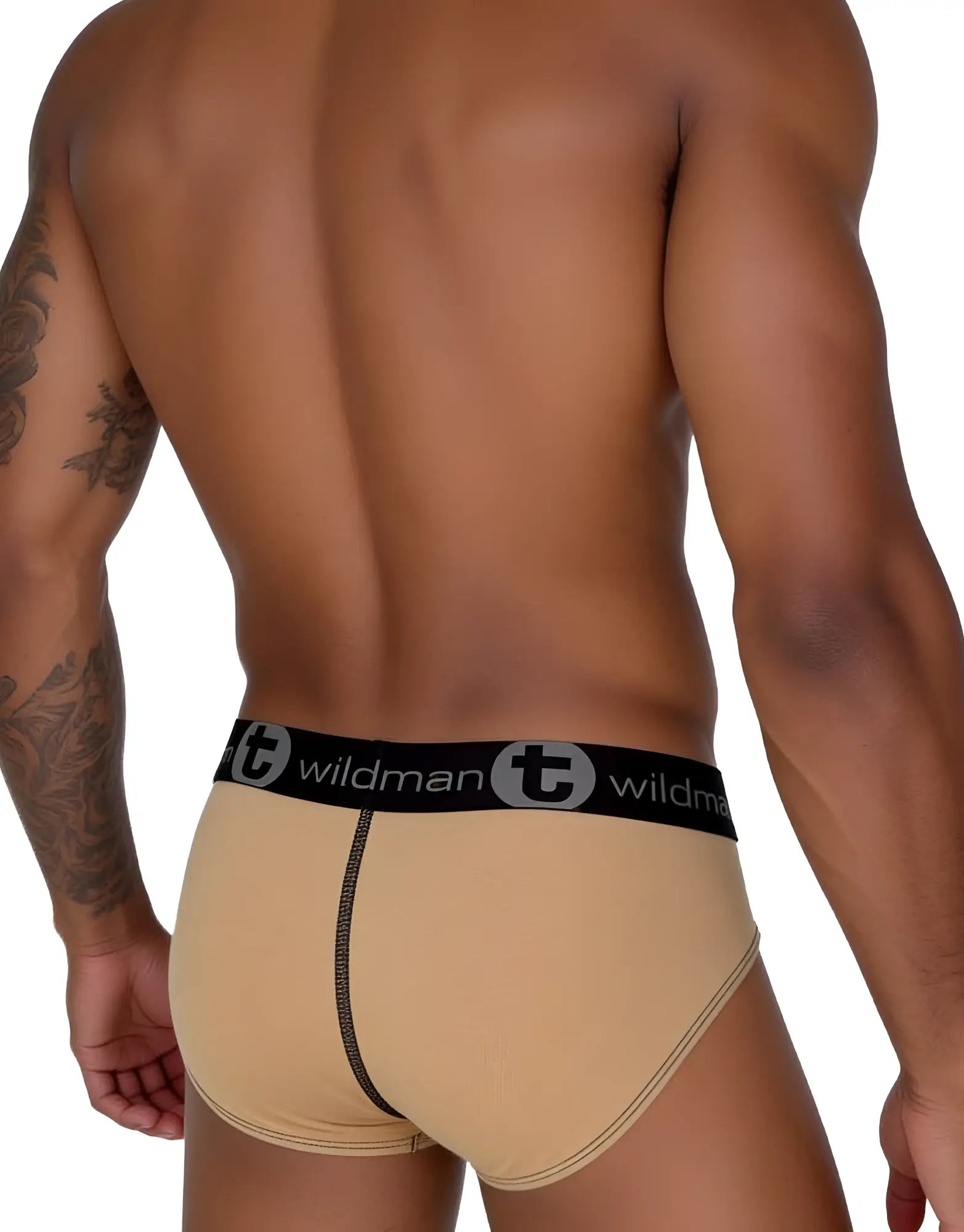 Beige wildman big boy cotton briefs with black elastic waistband featuring wildman logo and circular t emblem