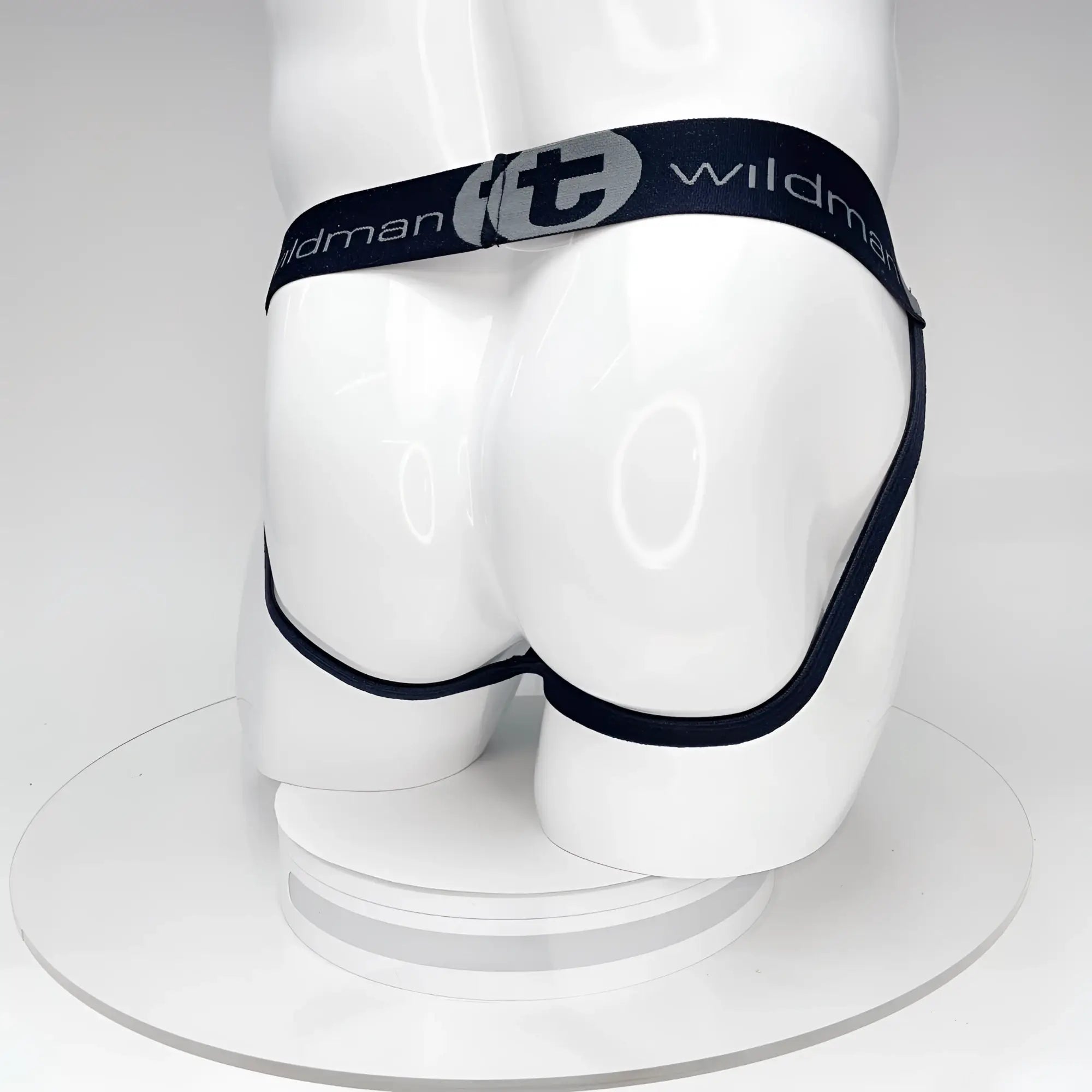 Black elastic waistband briefs with silver wildman logo and brand name on band in wildmant big boy pouch jockstrap black