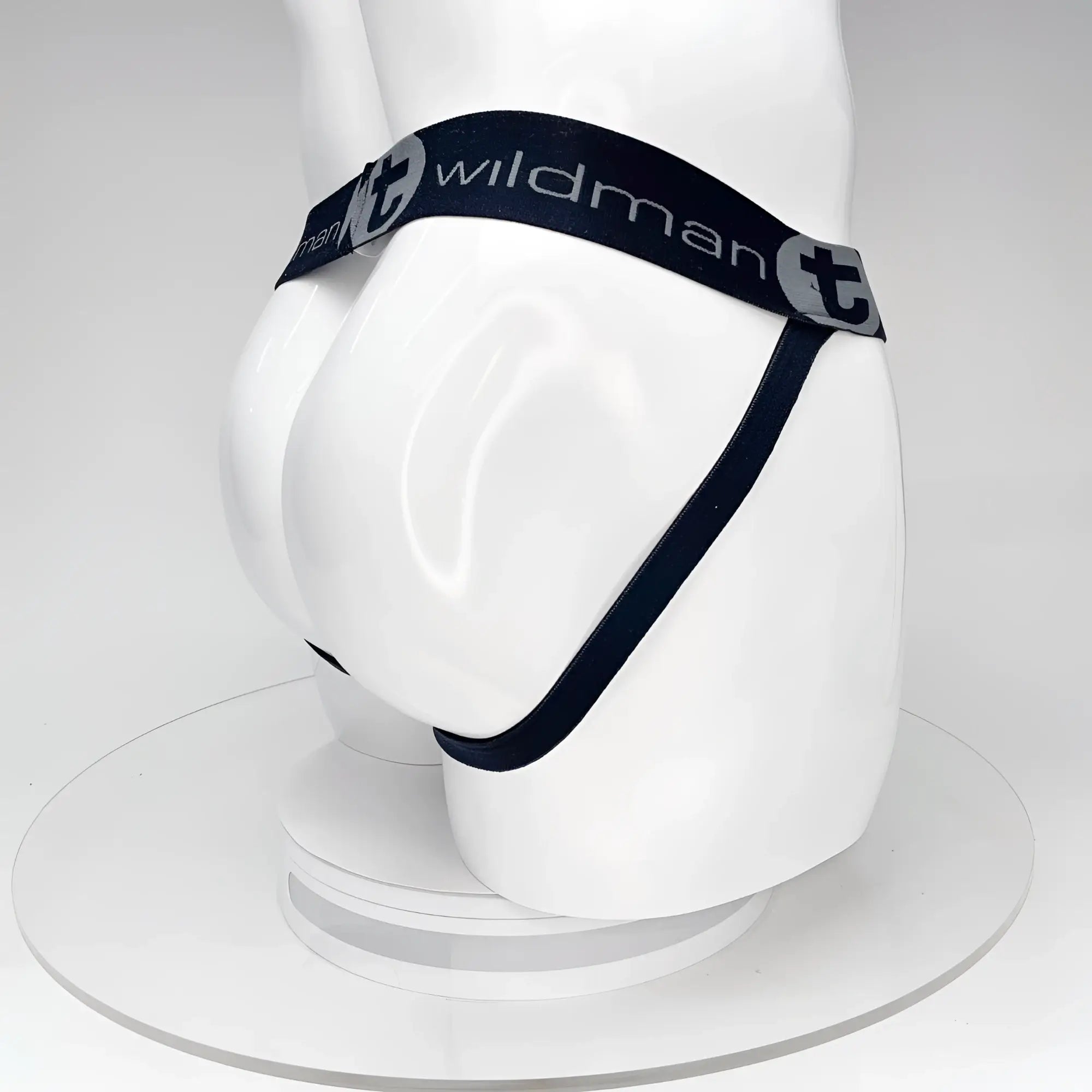 Black wildmanT big boy pouch jockstrap with elastic waistband and white branding worn on a mannequin