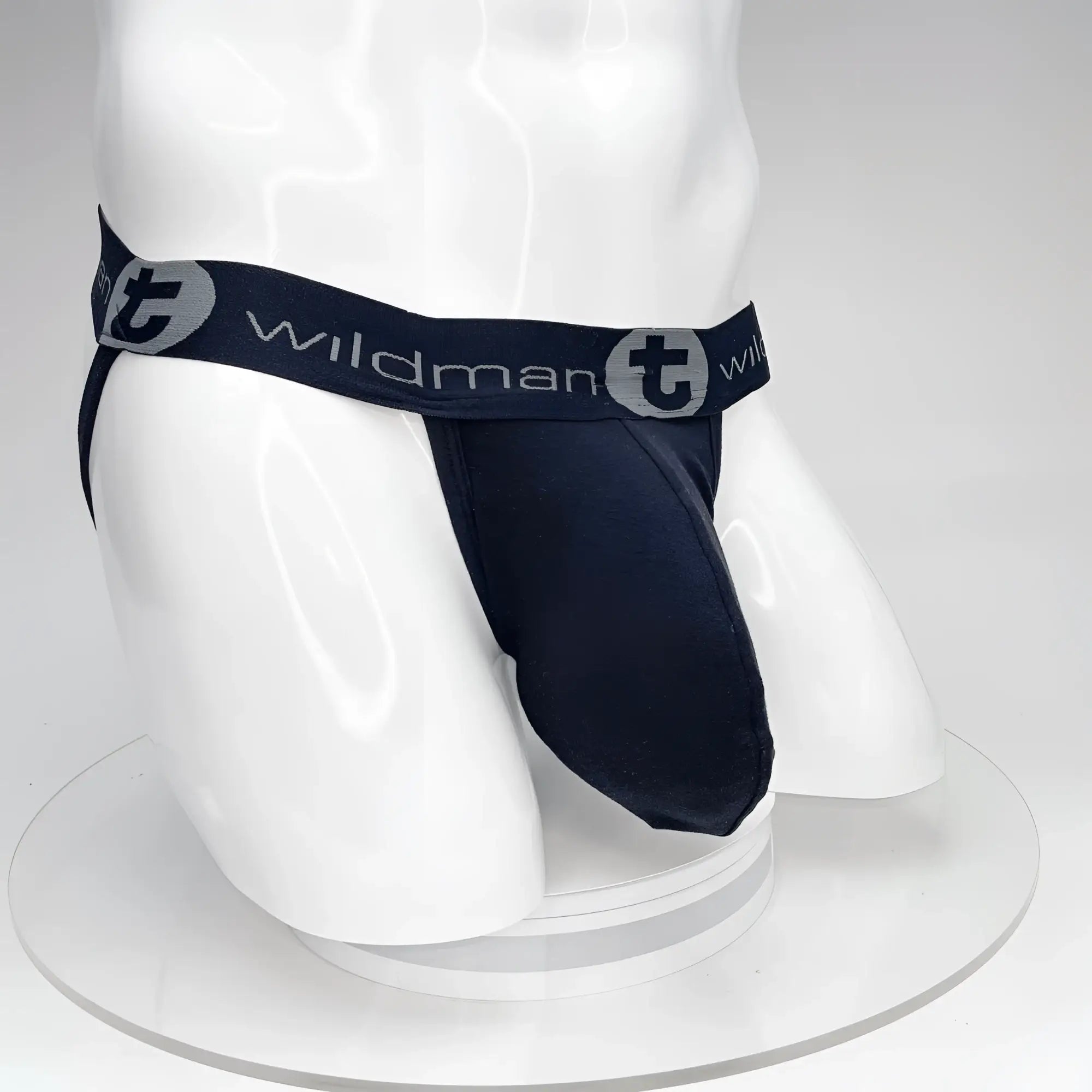Navy blue Wildman brand jockstrap with gray logo waistband features big boy pouch for support and comfort
