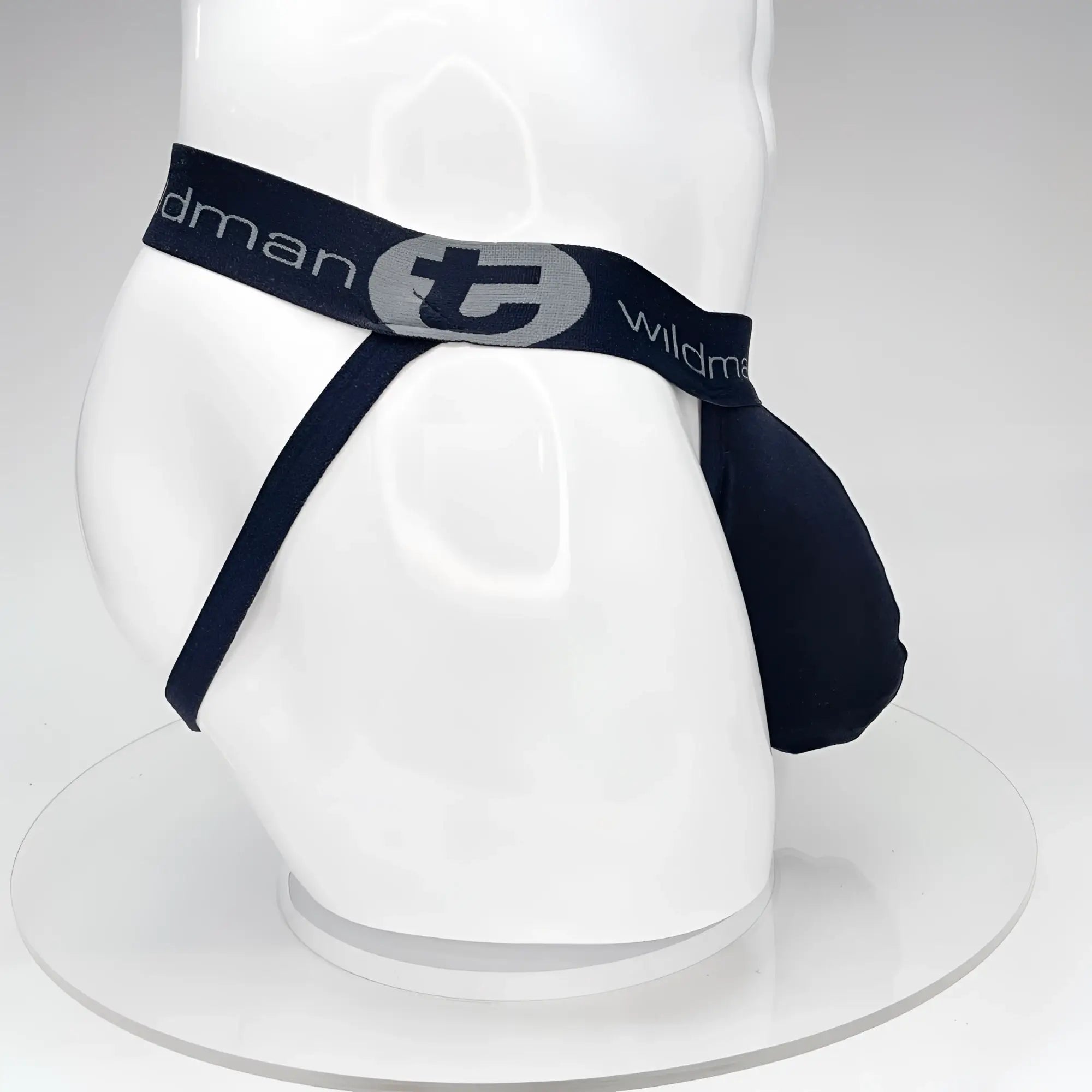 Navy blue WildmanT Big Boy Pouch jockstrap with gray logo and elastic waistband, front view