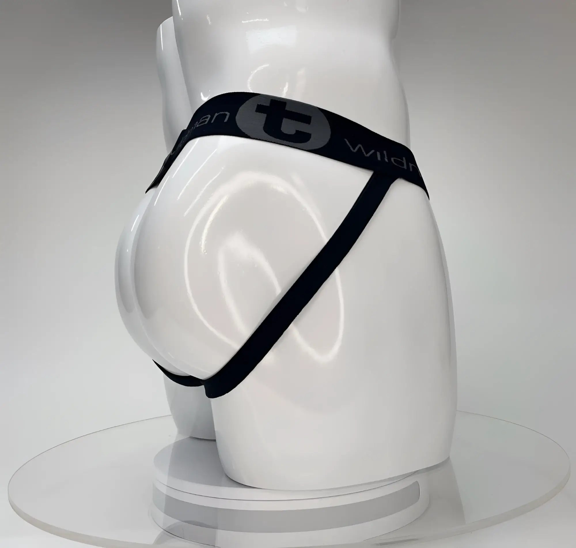 Wildmant big boy pouch jockstrap white with black elastic waistband and gray wild logo worn by white mannequin