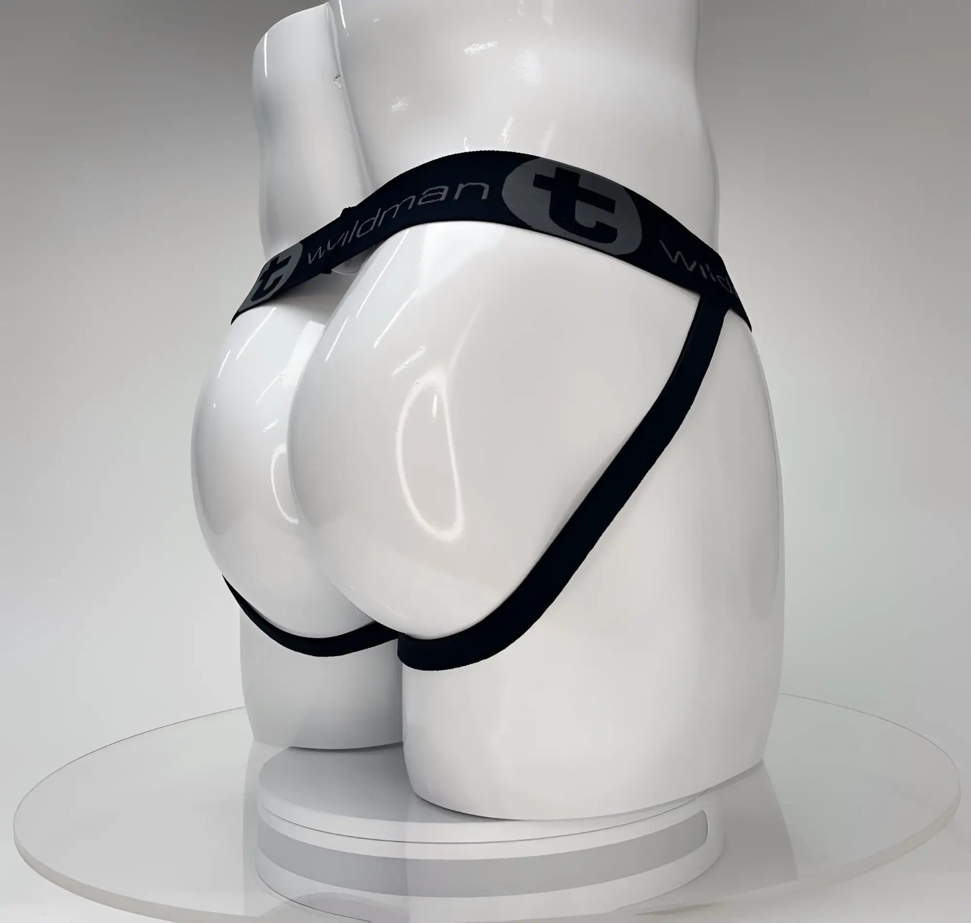Wildmant big boy pouch jockstrap in black briefs with elastic waistband and wildman branding on white mannequin