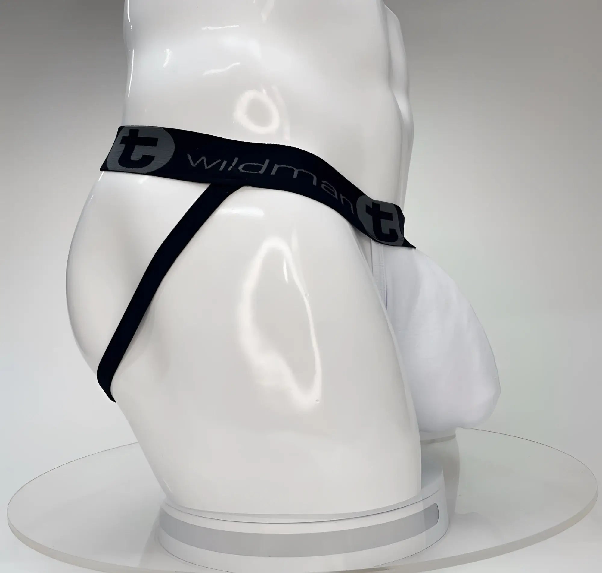 Wildmant big boy pouch jockstrap white on mannequin with black elastic waistband featuring wildman branding