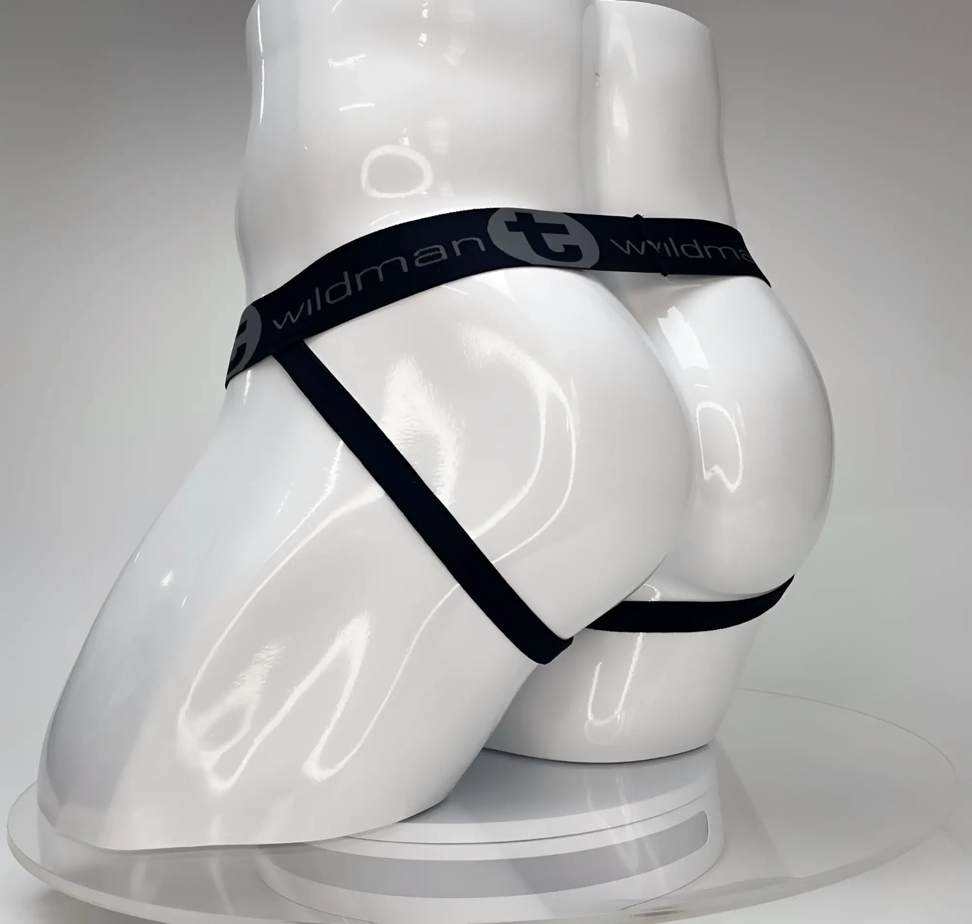 Black elastic waistband with ’wildman’ branding worn by a white mannequin.