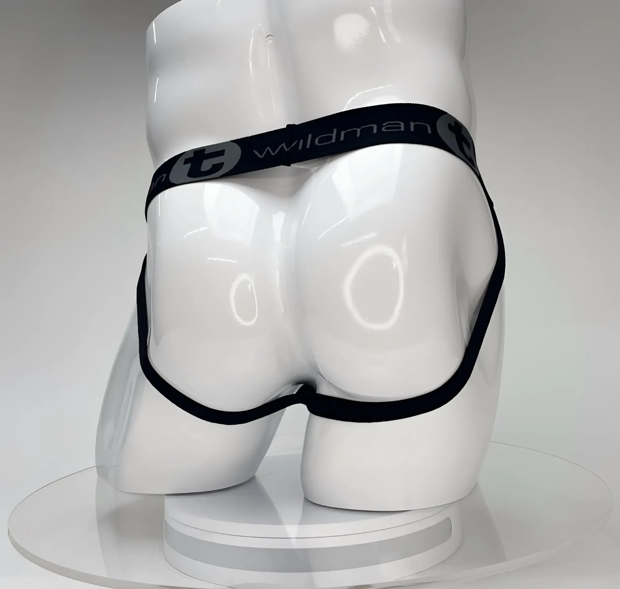 Black wildman briefs with sleek minimalist design and elastic waistband featured in wildmant big boy pouch jockstrap white