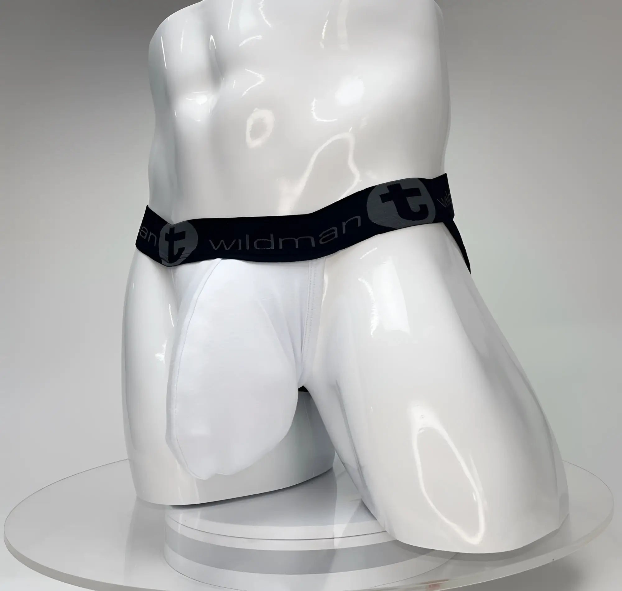 White wildman big boy pouch jockstrap briefs with black elastic waistband and wildman logo