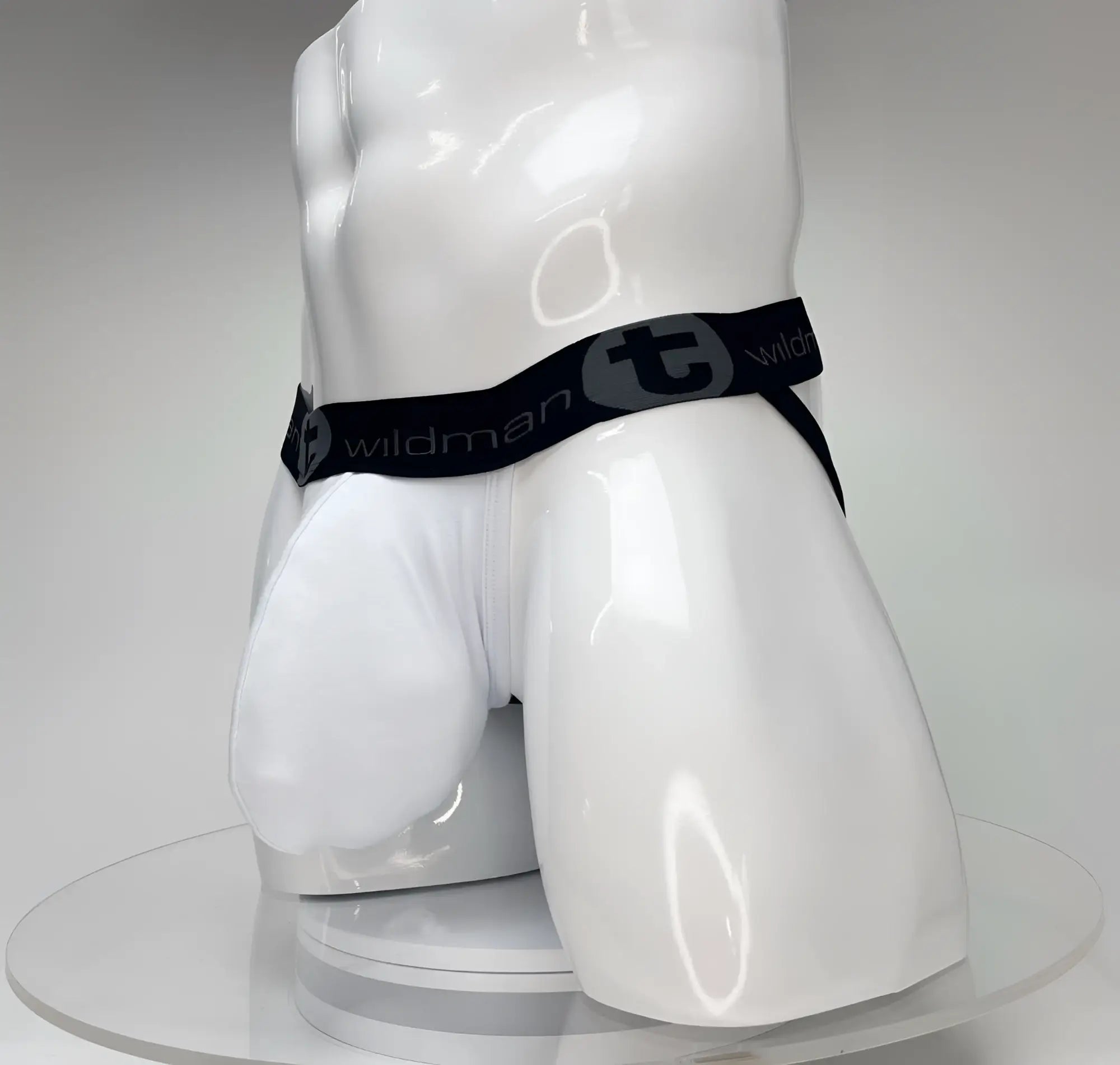 White wildmant big boy pouch jockstrap briefs with black elastic waistband and stylized t emblem