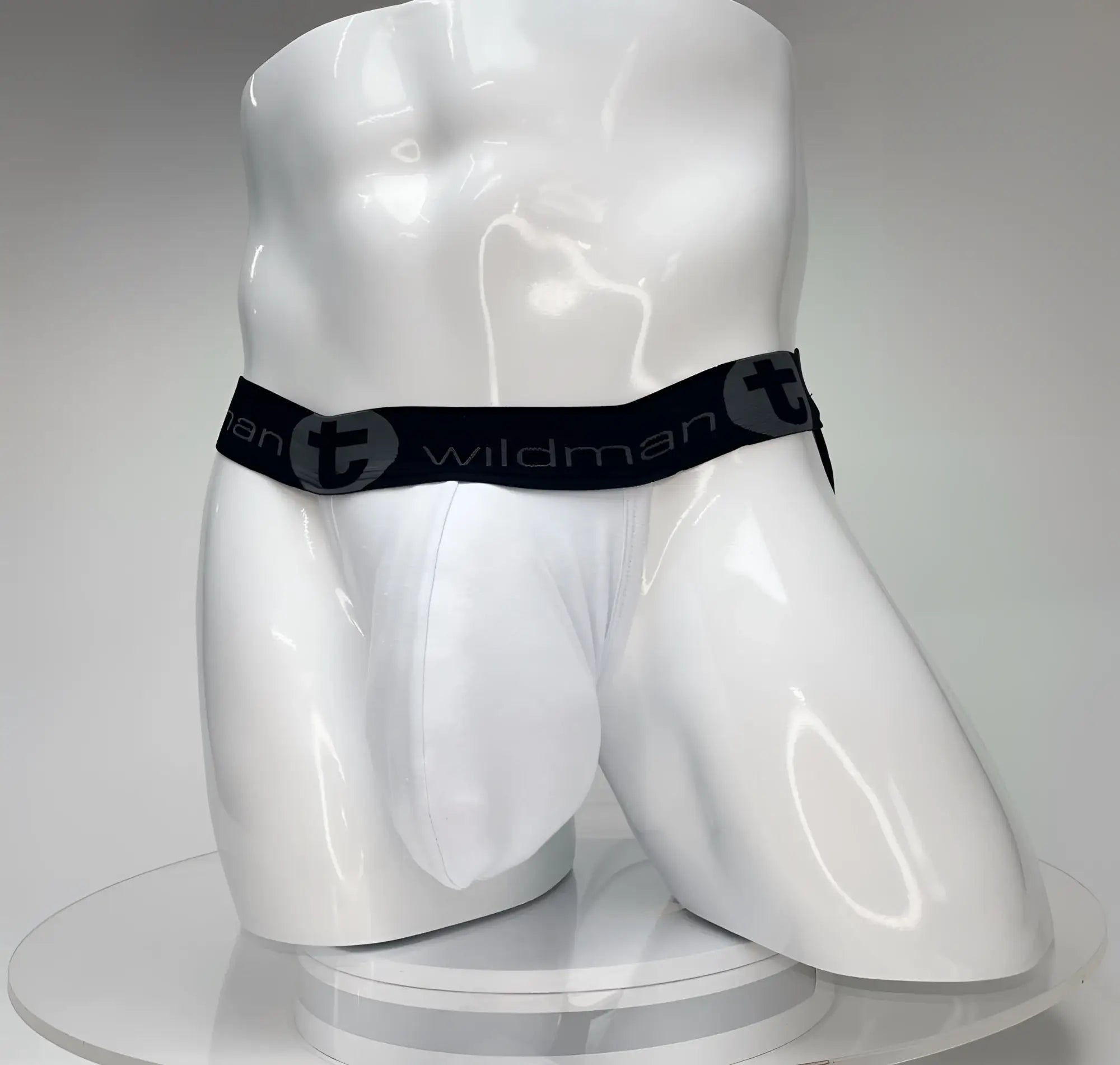 White wildman big boy pouch jockstrap with black elastic waistband featuring wildman brand logo