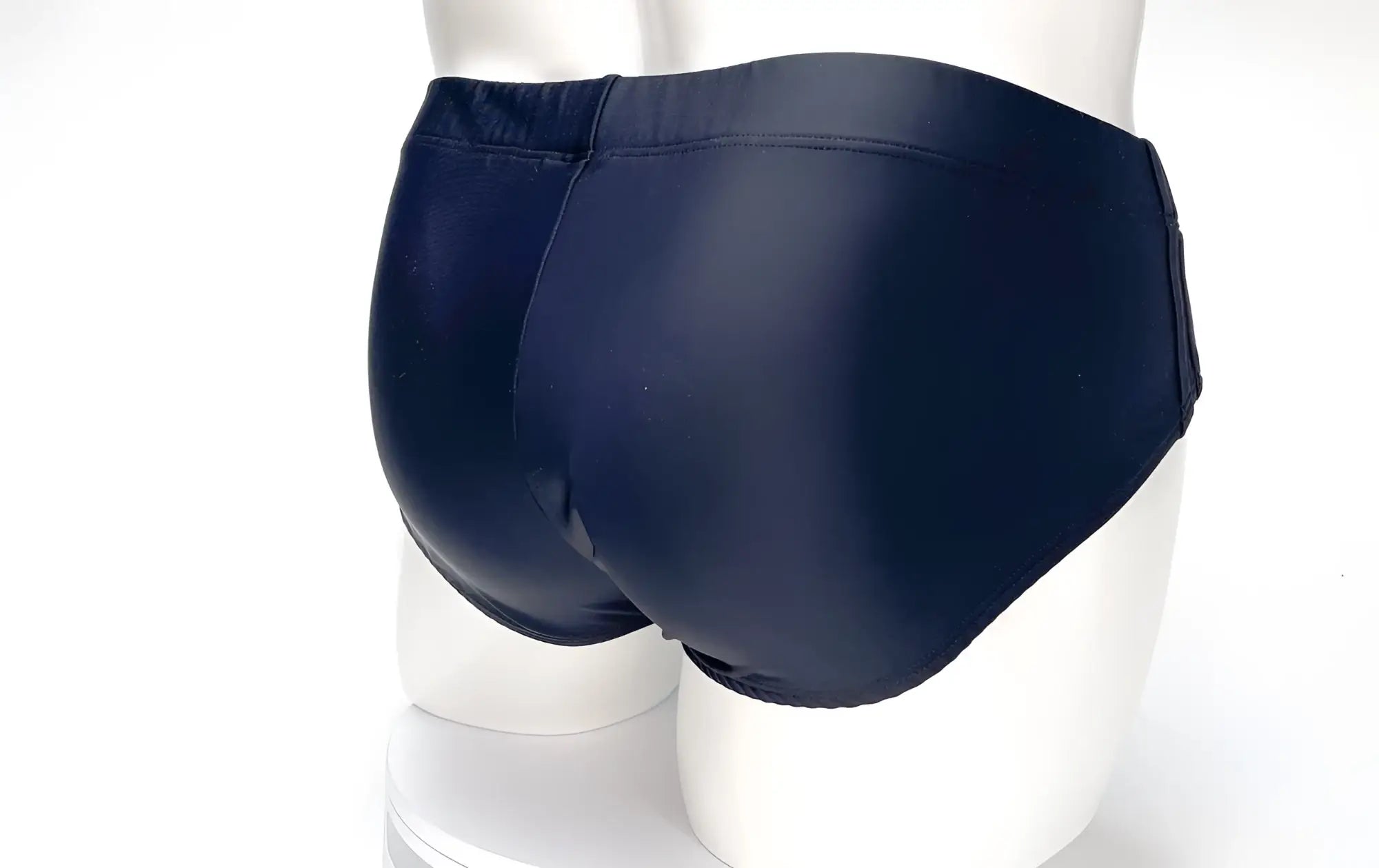 Wildmant big boy pouch swim brief in black features glossy, smooth, form-fitting swim trunks for men