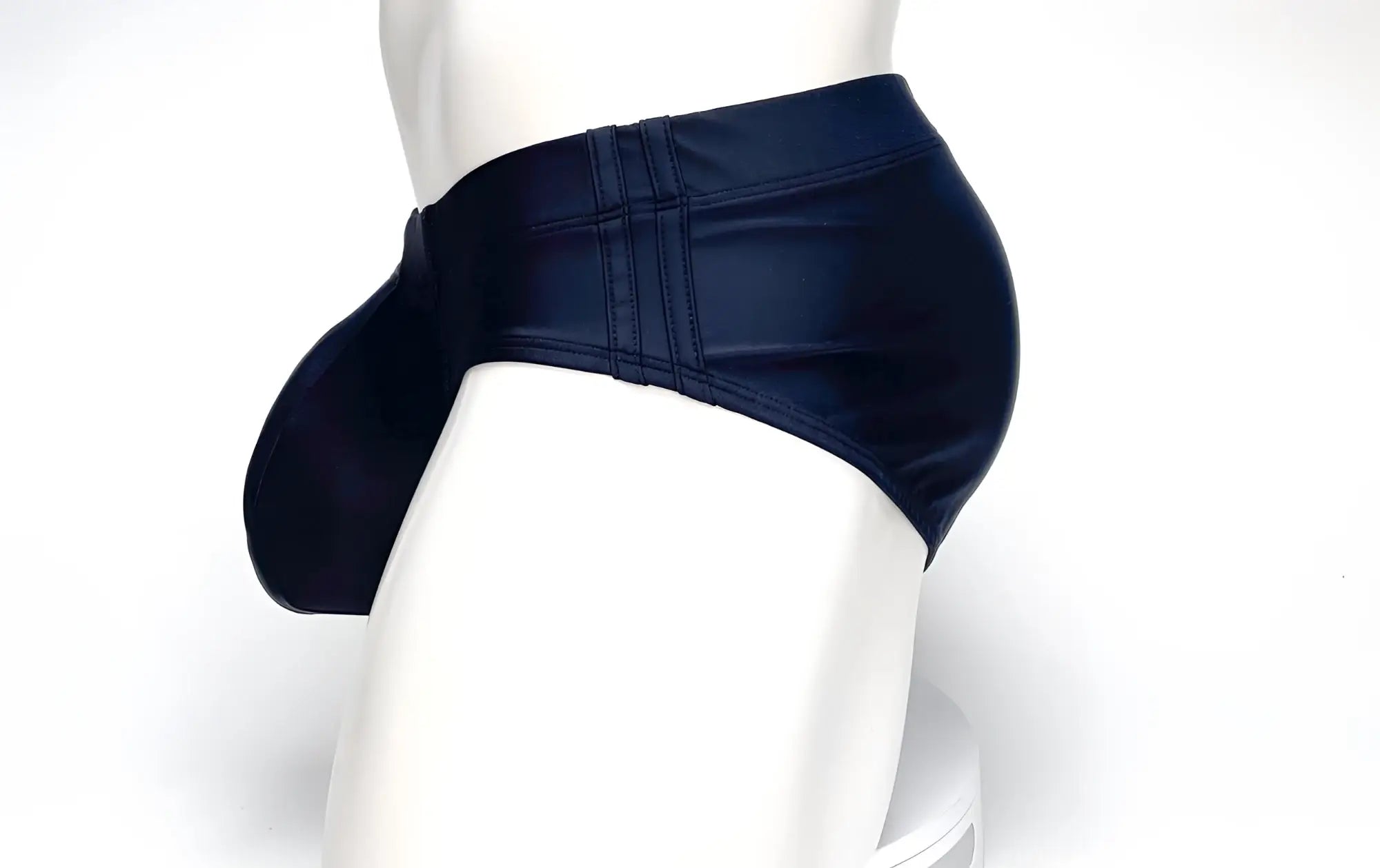 Wildmant big boy pouch swim brief in navy blue faux leather with prominent side pouch and stitched seams