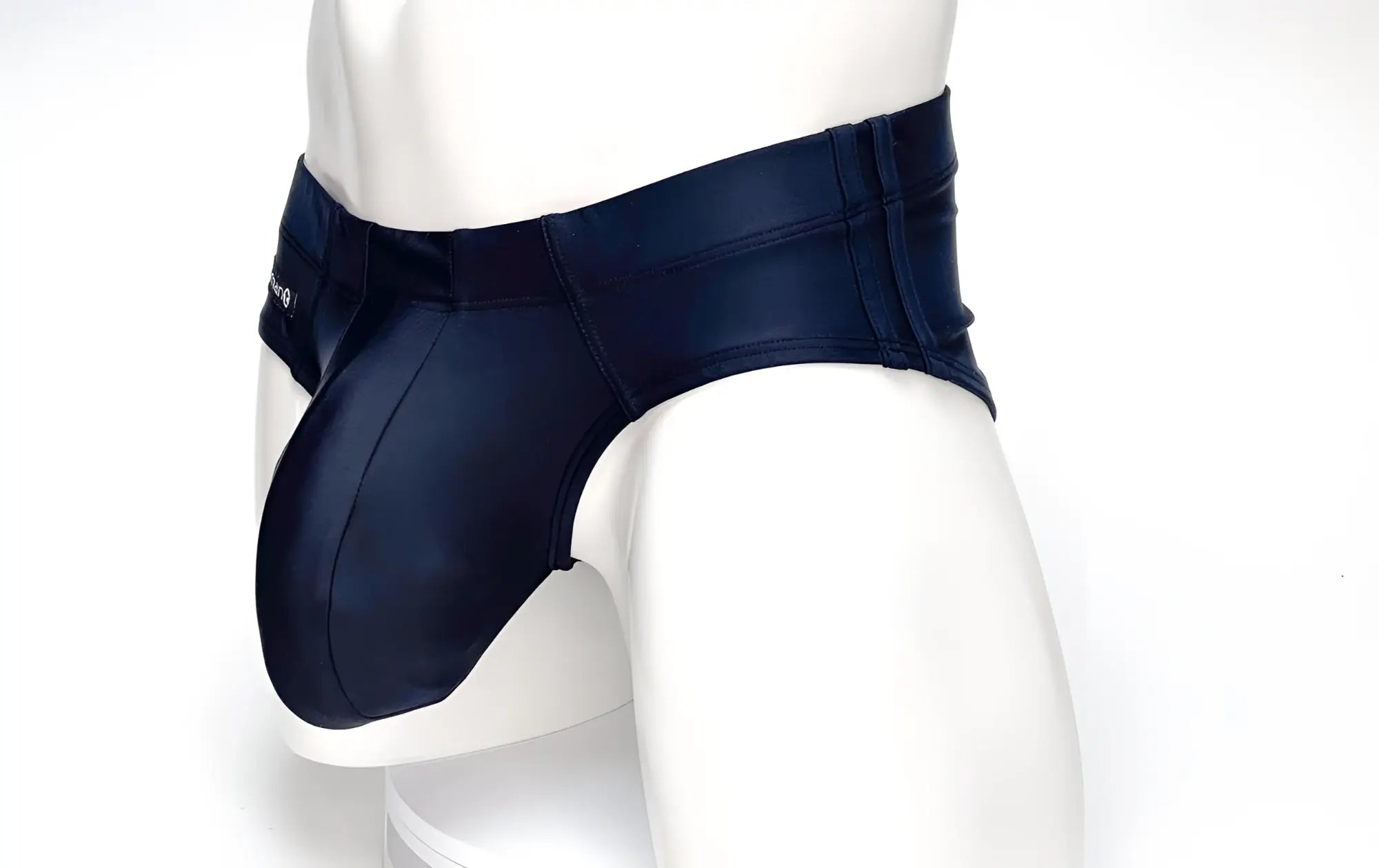Wildmant big boy pouch swim brief in navy blue faux leather with sleek form-fitting design and subtle stitching details