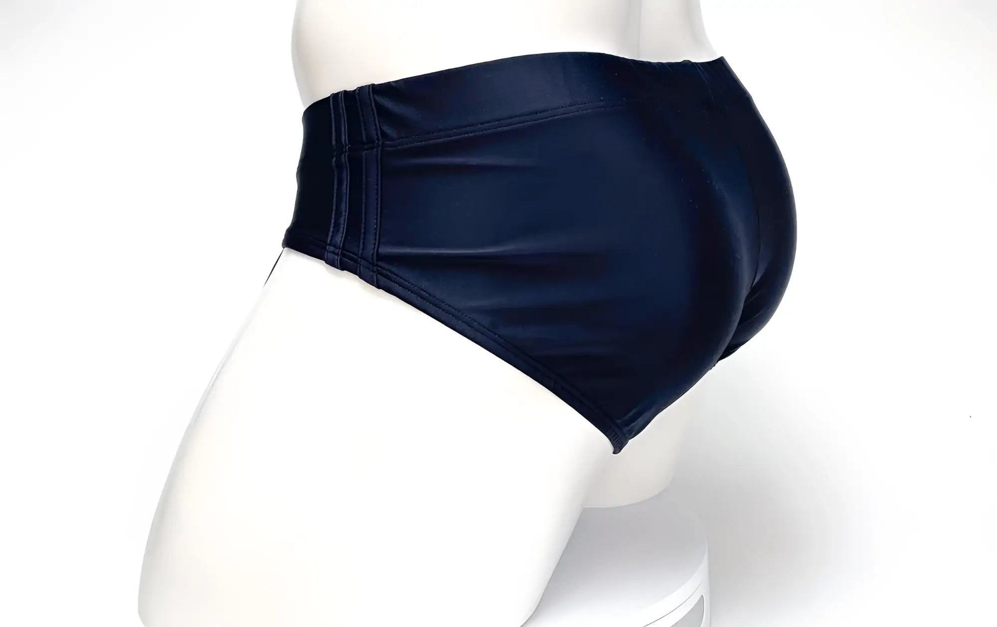 WildmanT big boy pouch swim brief in navy blue shiny fabric with high-waisted design for comfortable swimwear