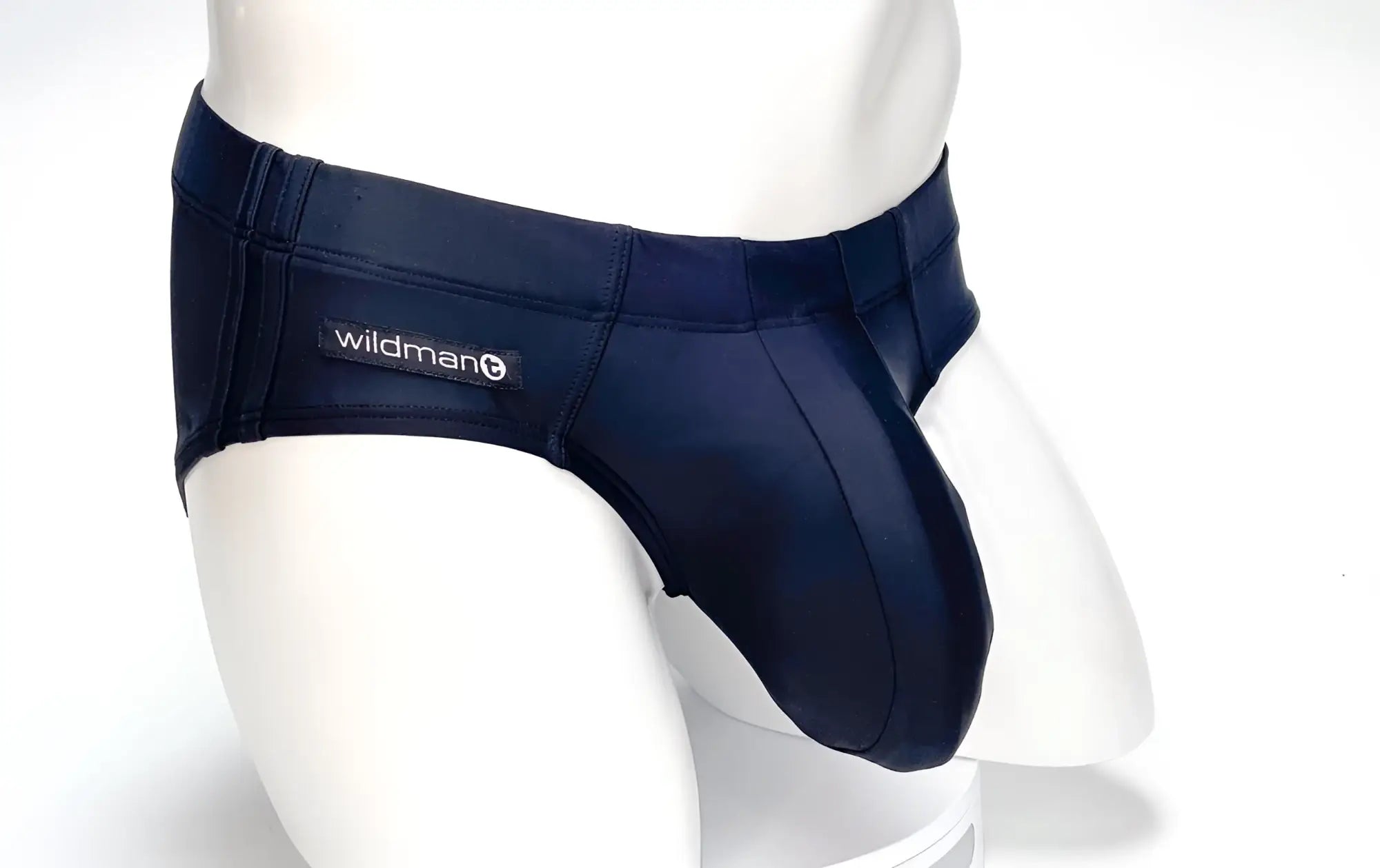 Navy blue stretch fabric WildmanT Big Boy Pouch swim brief with Wildman brand label on the waistband